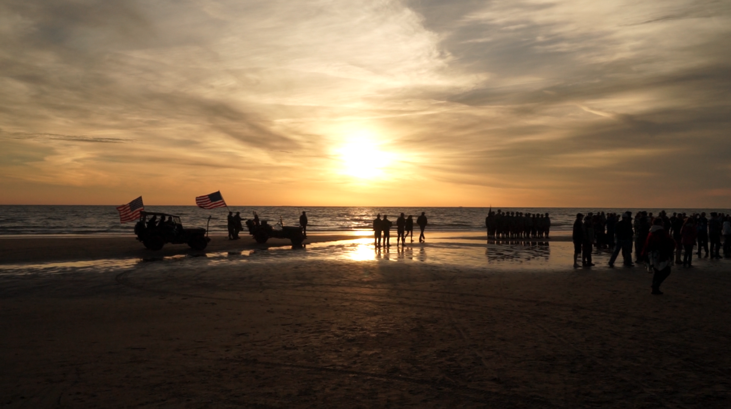  Soldiers and reenactors gather on Omaha Beach for a dawn ceremony commemorating D-Day’s anniversary. 