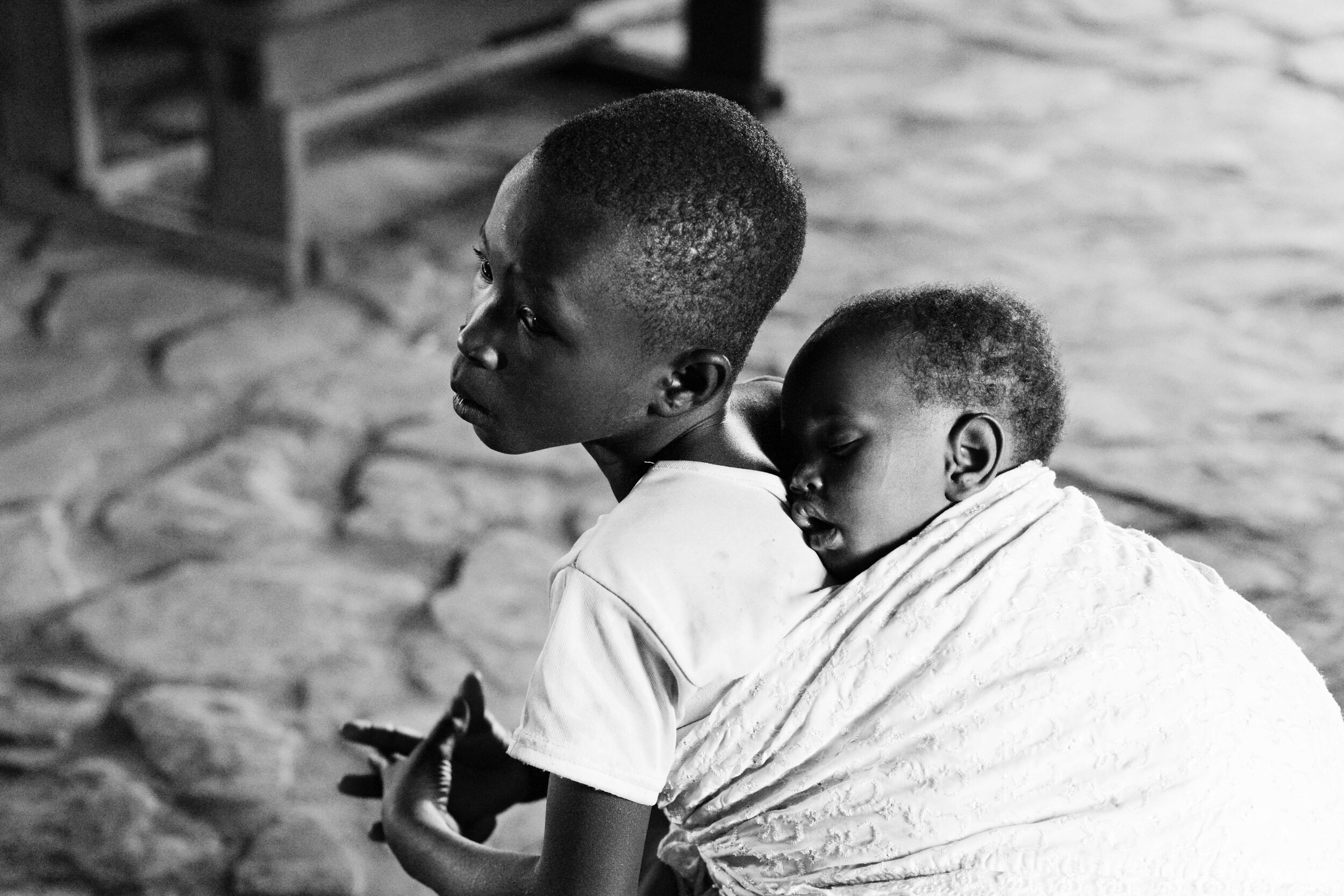  Children in Rwanda assume responsibilities at a very young age. Taking care of one’s younger siblings is a childhood reality for both girls and boys.  