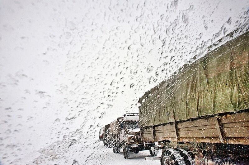  Indian army trucks pass through the Karakorum Road, one of the world’s highest, during a snowstorm. 
