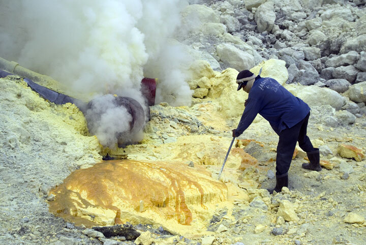  A network of ceramic pipes installed on the steaming slopes of the crater channels volcanic gases, which come out as molten sulfur. The miners pry out chunks as they condense and solidify. 