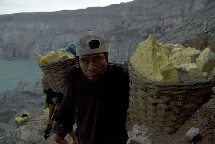  Padi has been working in the mine for 15 years. He gets paid Rp 800 ($0.06 USD) per kilogram of sulfur and earns about $12 USD for carrying a total of 150 kilograms in two trips. 