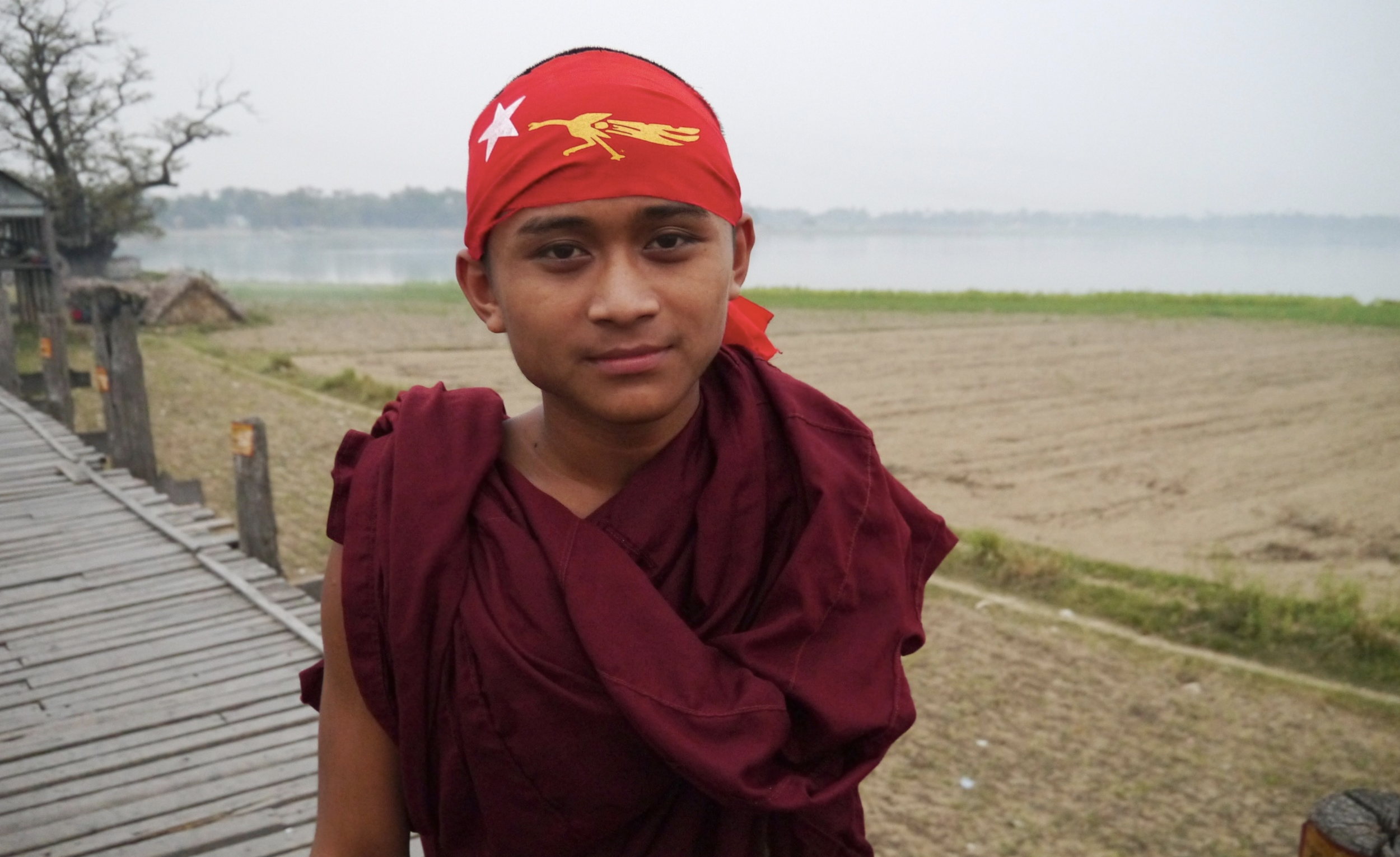  A young monk wears the white star and golden peacock insignia of the NLD. Monks of Burma have been among the staunchest supporters of Suu Kyi, and their “saffron revolution” of 2007 still counts as among the most important protests since the first u