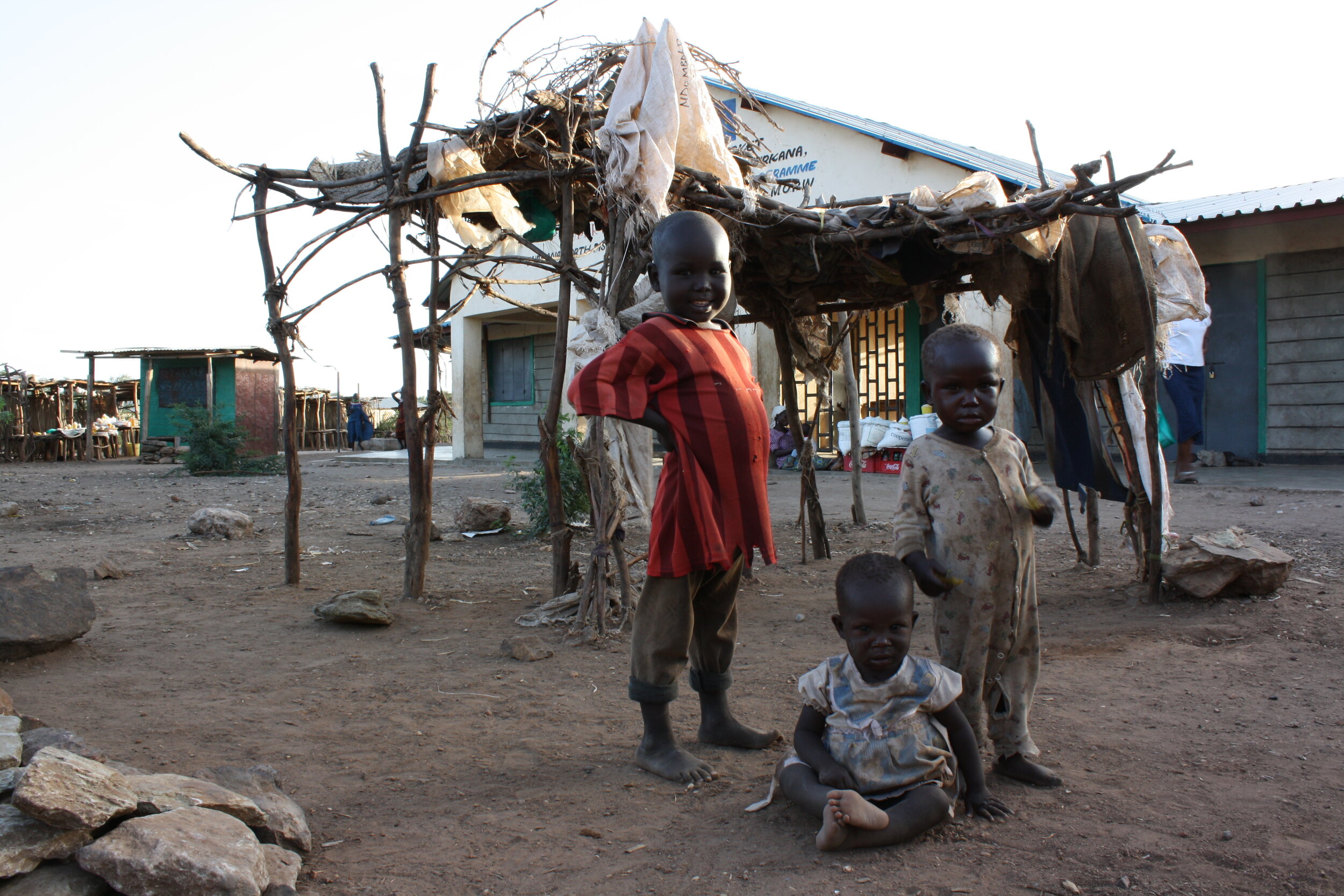 Three siblings in the market outside Kakuma Refugee Camp. 