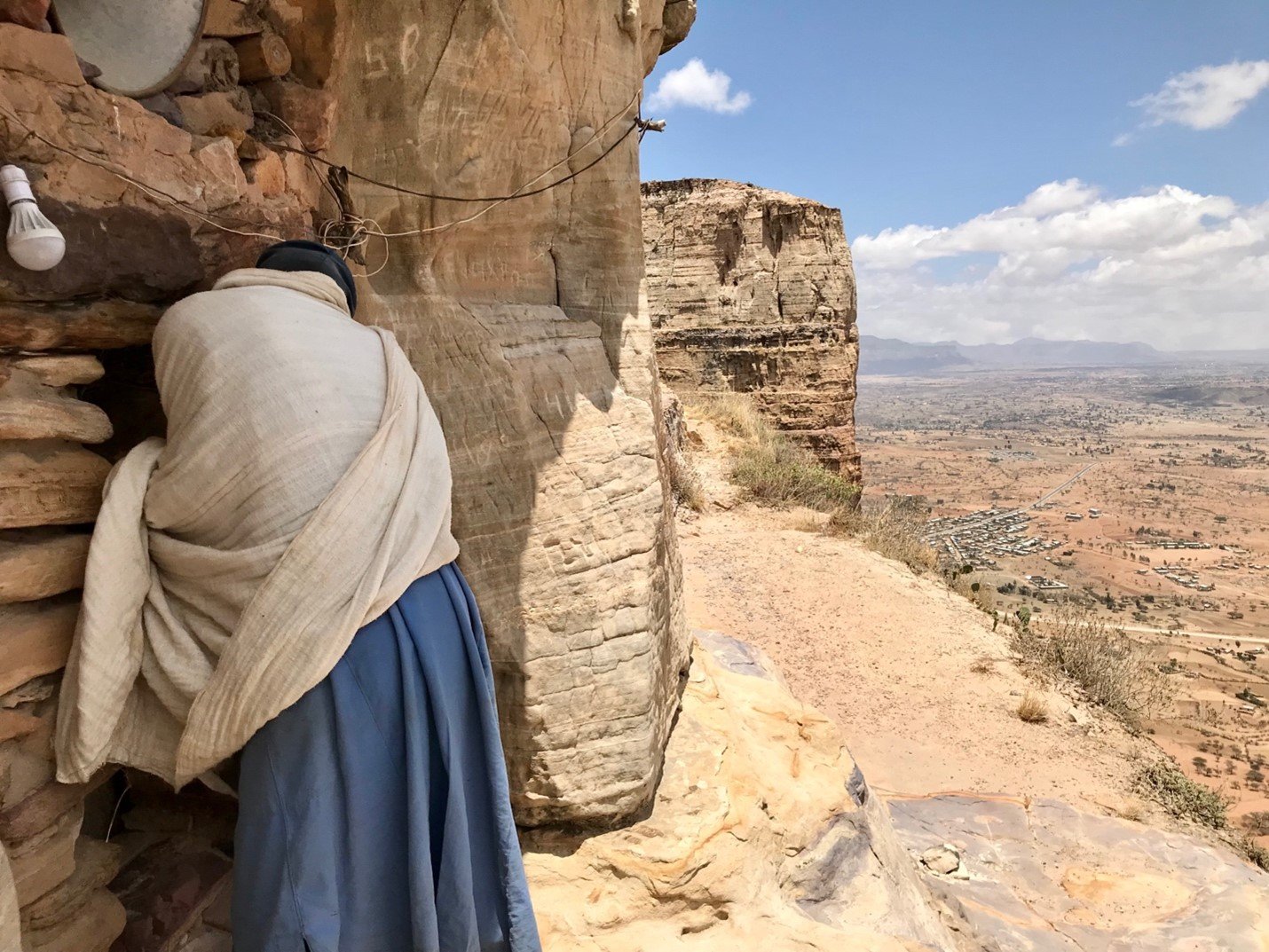  A priest opens the door to one of the Gheralta churches in Megab, Tigray, Ethiopia.&nbsp; 
