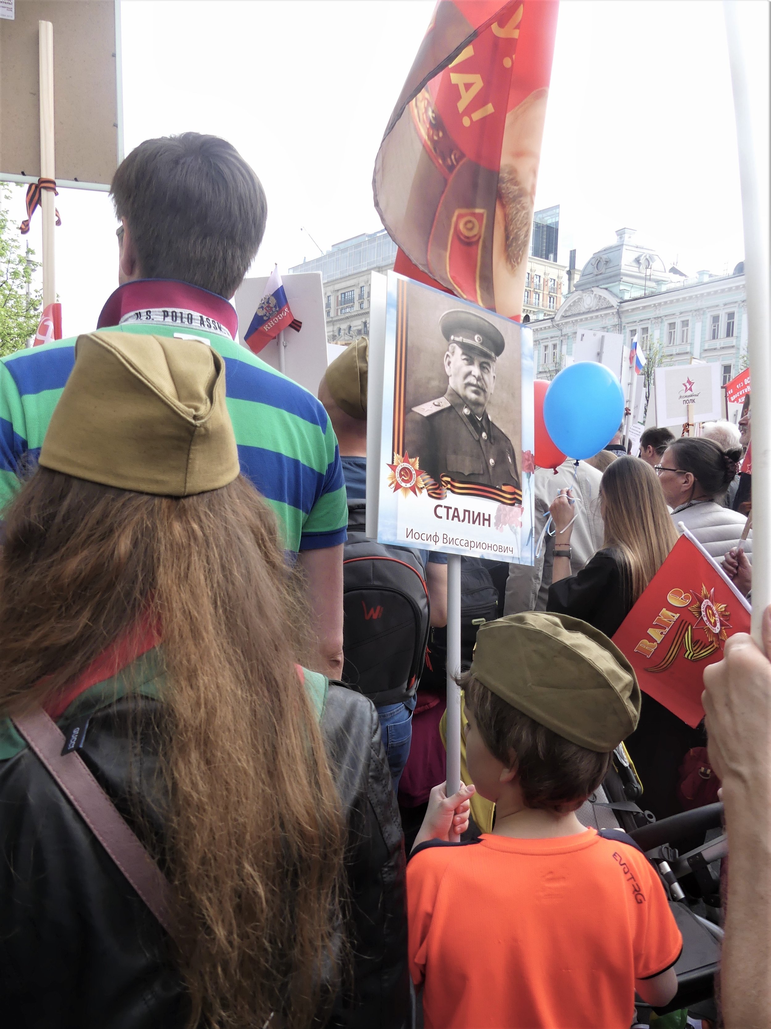  A child holds a placard with a picture of Joseph Stalin — similar to the one which triggered the verbal altercation I witnessed later that day. 