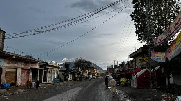   Photo 2:  A street in a displacement settlement in Khyber Pakhtunkhwa, Pakistan. For many Afghan refugees, these urban peripheries are the only places where they can find informal work, often in high-risk sectors like mining and construction. 