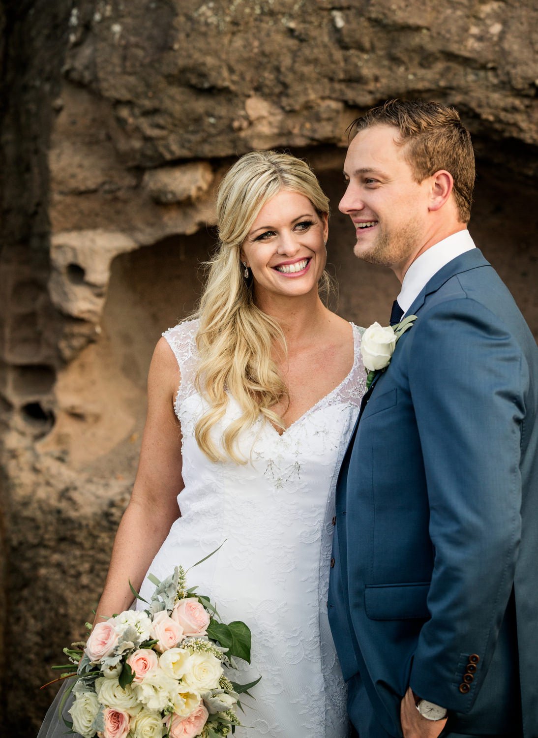 Newlyweds sharing a candid moment at their wedding