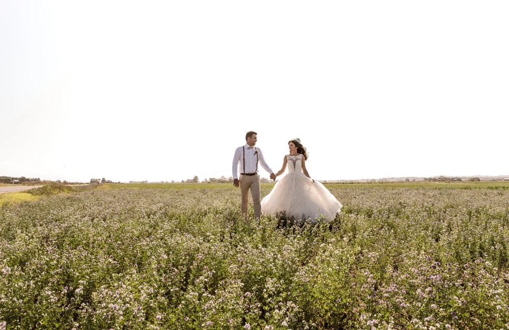 Hand in hand among the flowers