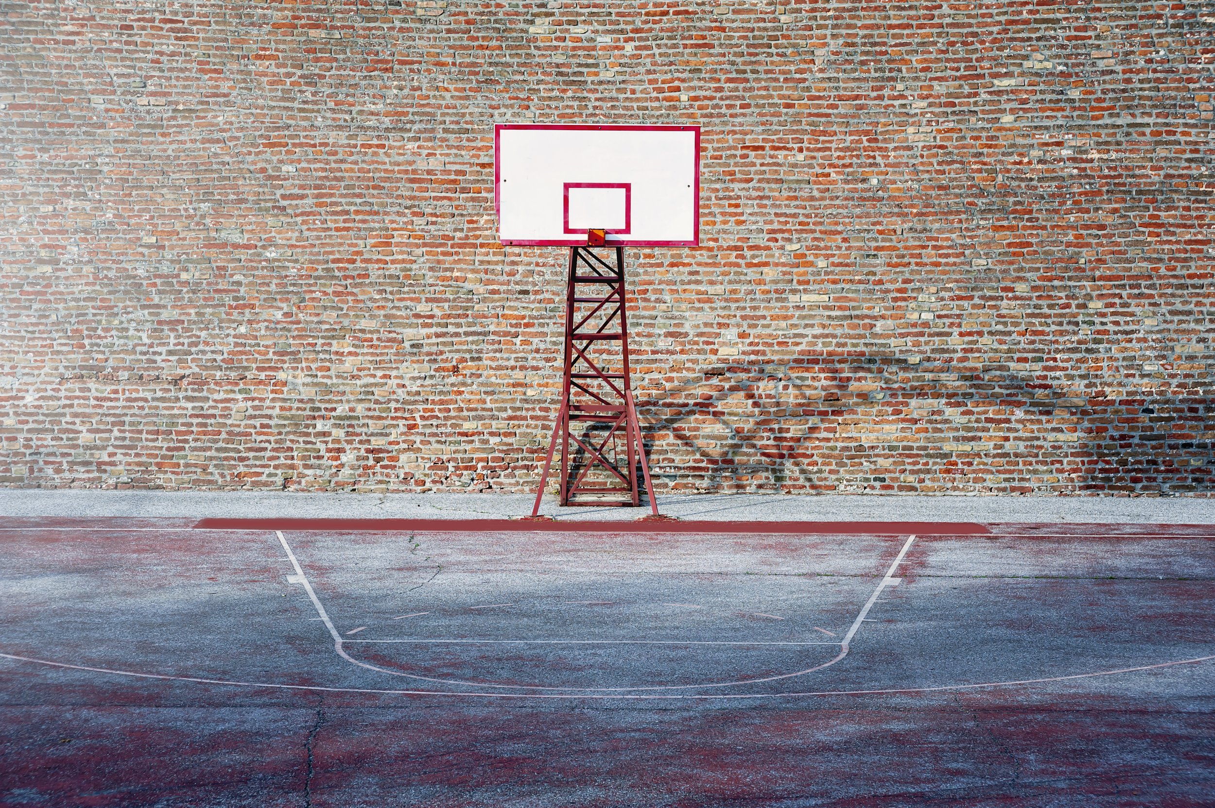 basketball-court-surounded-by-the-brick-walls-spo-2021-09-07-20-10-25-utc.jpg