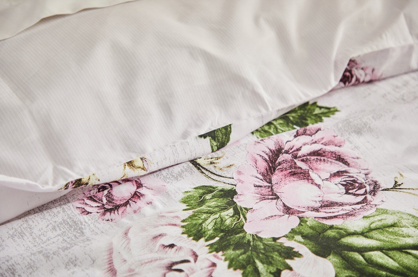 Celestia Linen captivates with its vibrant array of delicately hand-sketched pink peony bouquets scattered on a faux textured ground 🌹 ⁠
⁠
Reverse Celestia to showcase its subdued pinstripe underside. ⁠
⁠
#celestia