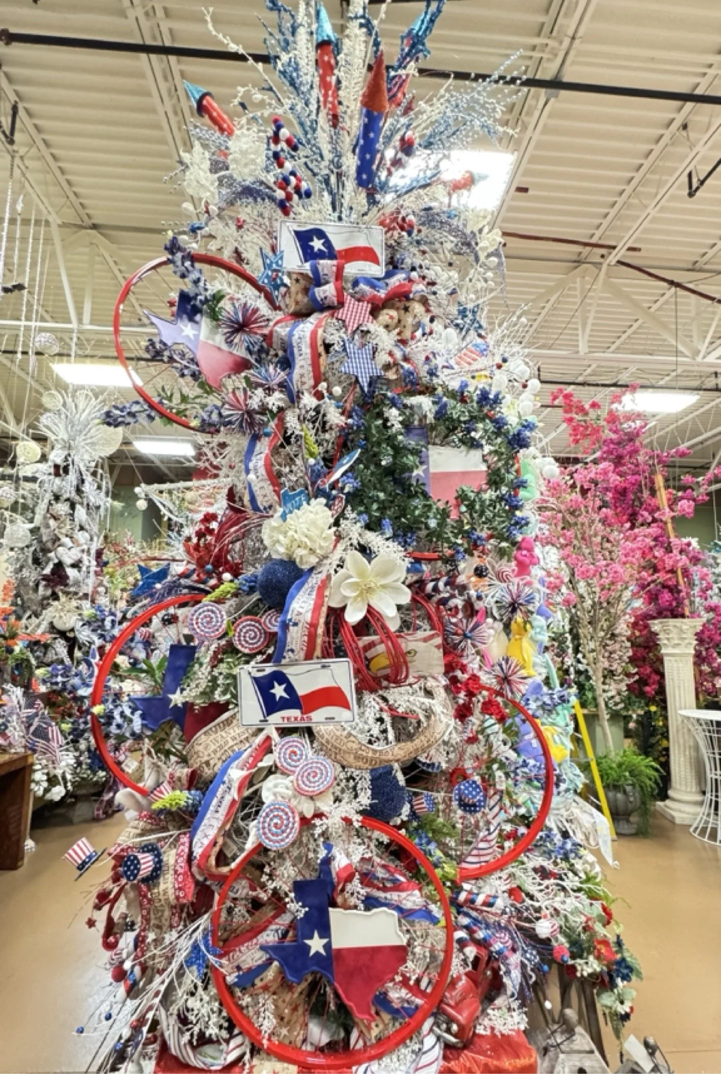 Texas theme Christmas tree with state flags, bluebonnets, and red, white, and blue ribbon