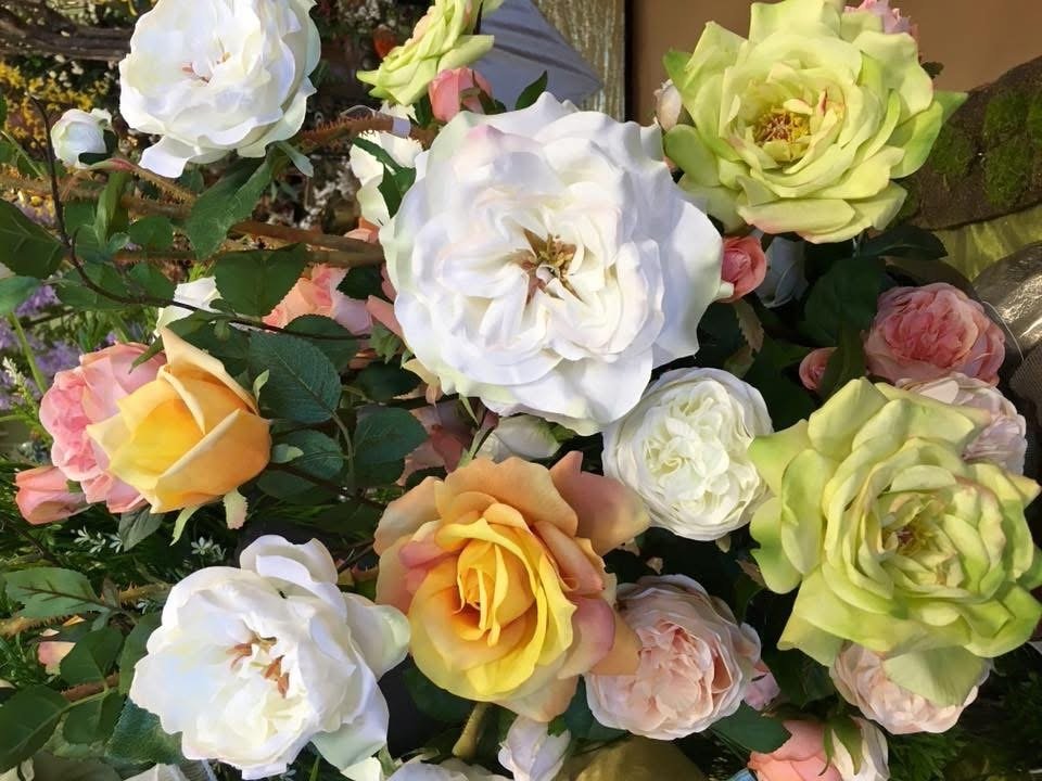 Close-up of silk roses in white, peach, and green by Arcadia Floral & Home Decor in Houston