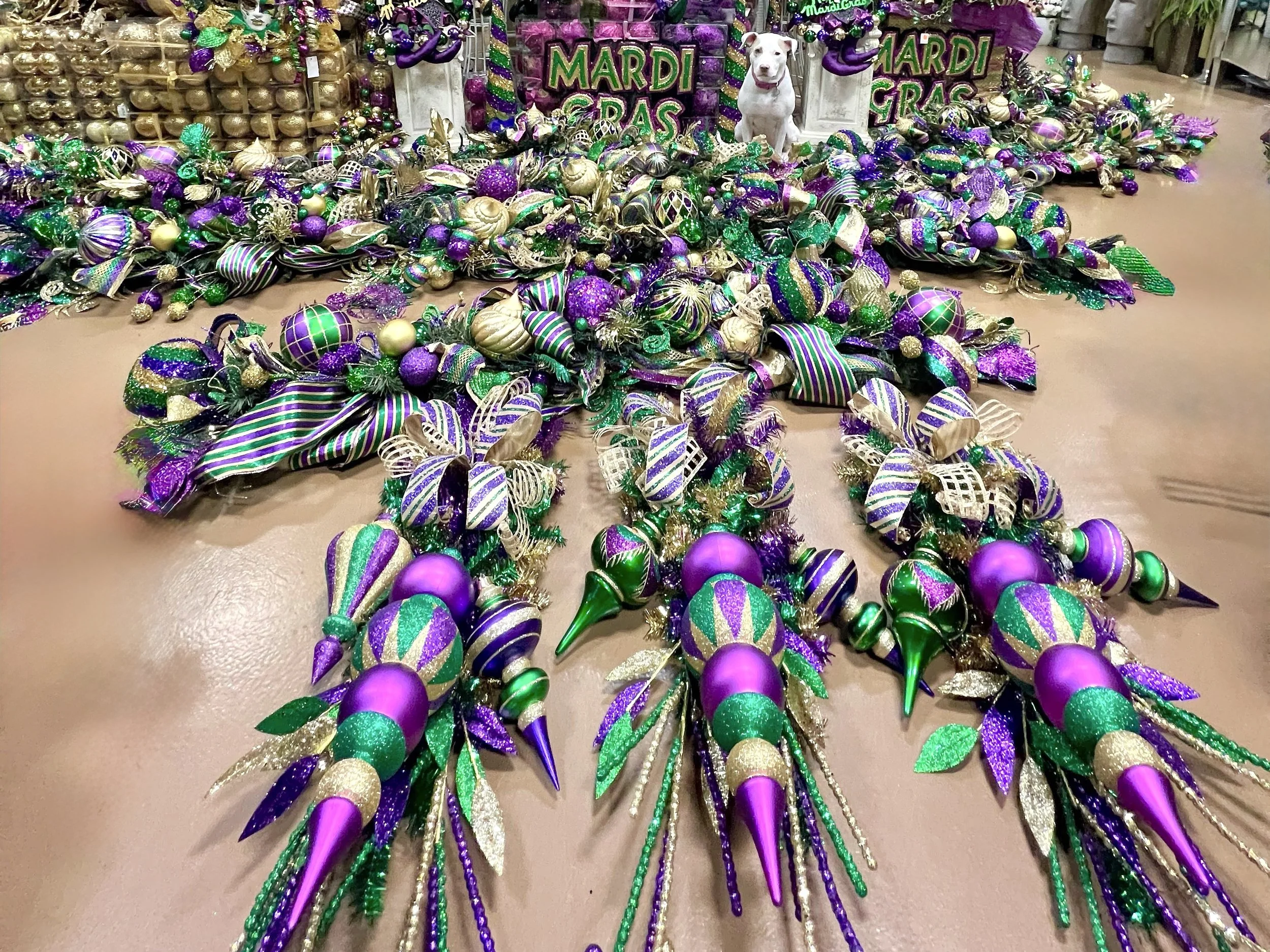 Mardi Gras picks and finials in purple, gold, and green at Arcadia's Houston showroom