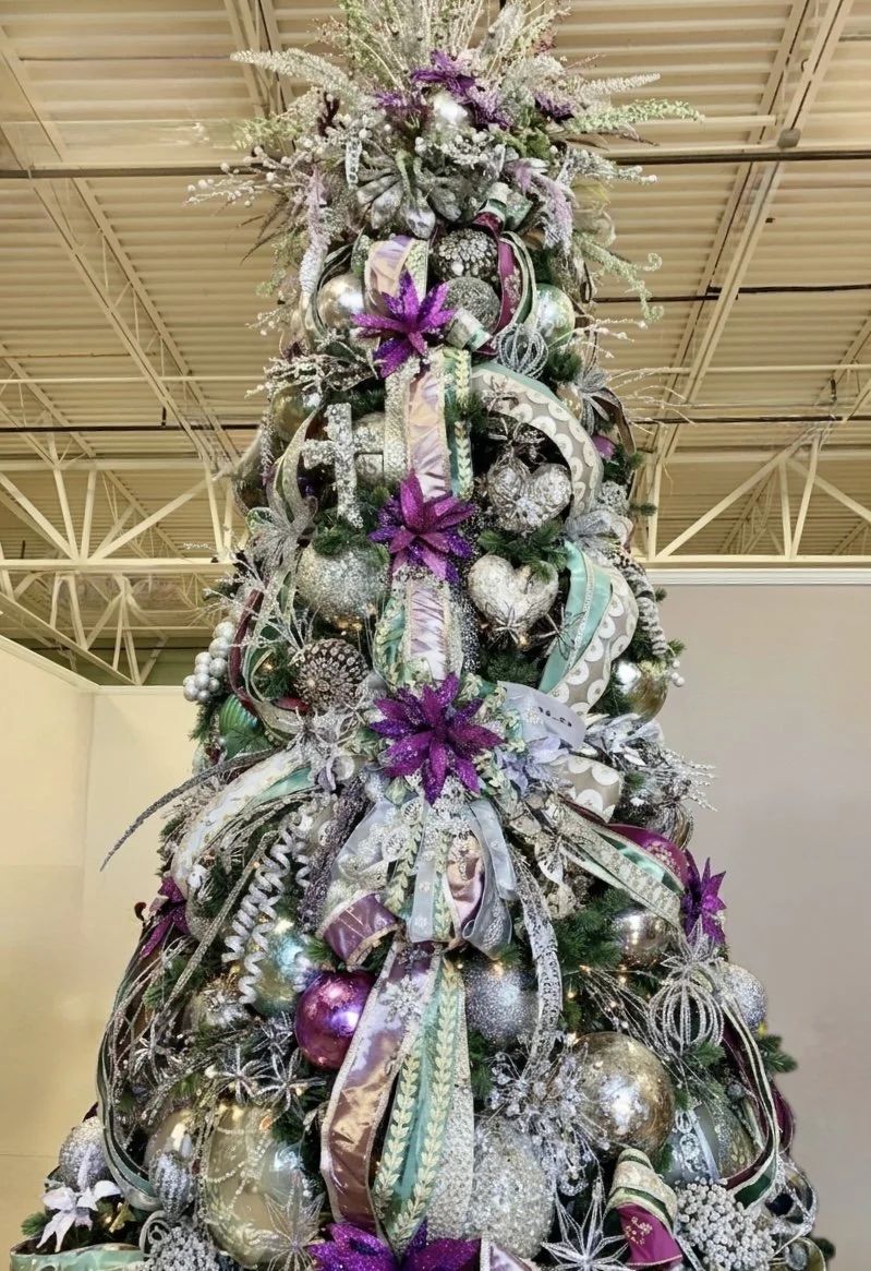 Glam Christmas tree in amethyst, silver, and mint with mercury glass ornaments at Arcadia's Houston showroom