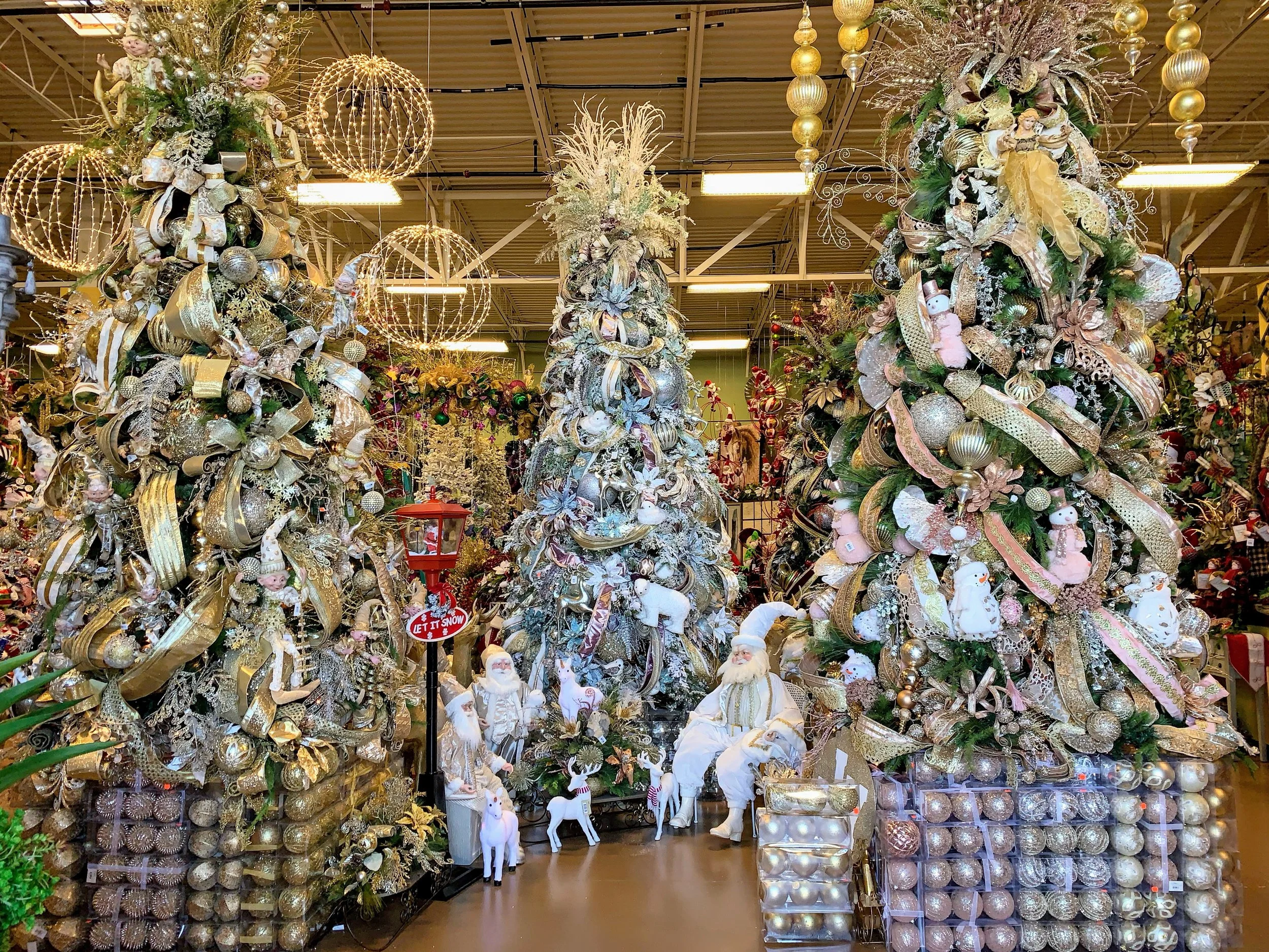 Designer Christmas trees in champagne and blush at a Houston Christmas tree store