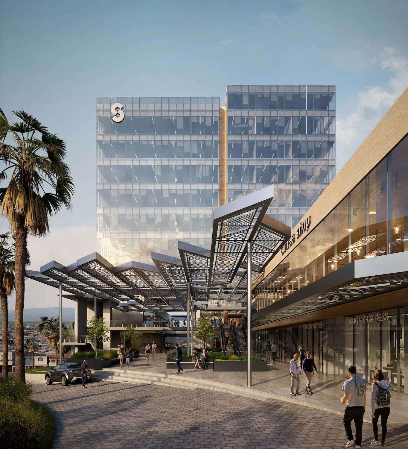 Office building with glass facade at sunset