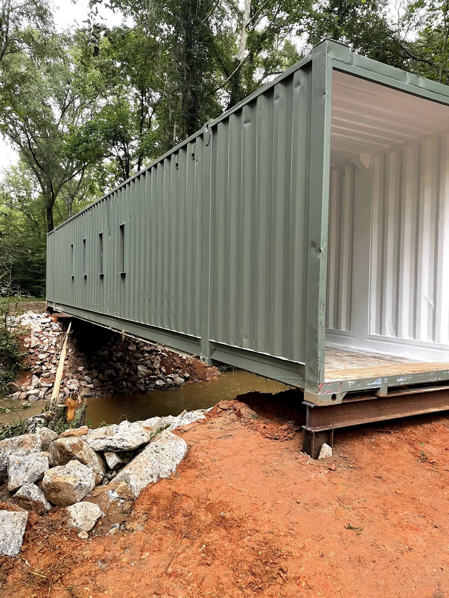 HUNTING PROPERTY BRIDGE BUILD ✅🦌

This hunting property had a creek crossing that turned into a swamp every time it rained - no access to food plots, stands, or the back of the lease.

We installed a steel container bridge rated for side-by-sides, A