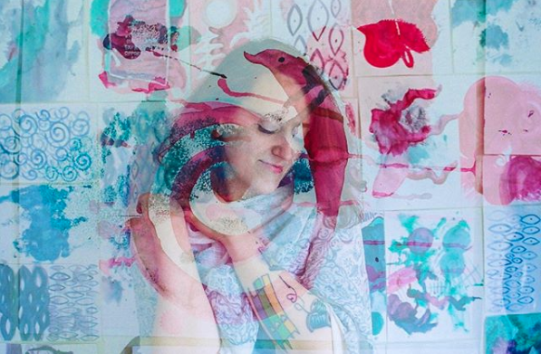 Molly with her watercolour art, photo by Ashley River Brant