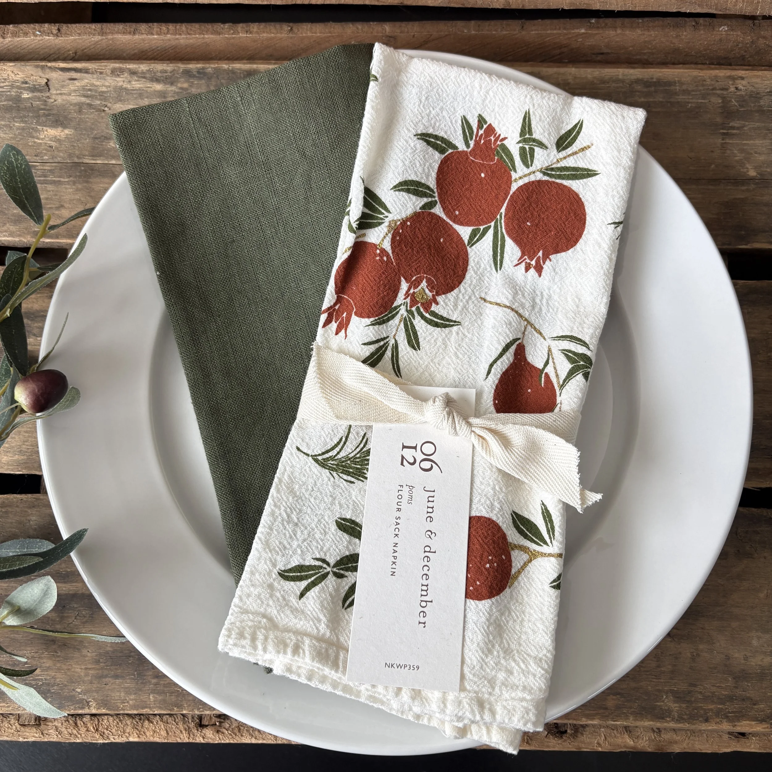 Poms Cotton Napkin with Olive Linen Napkin.JPG