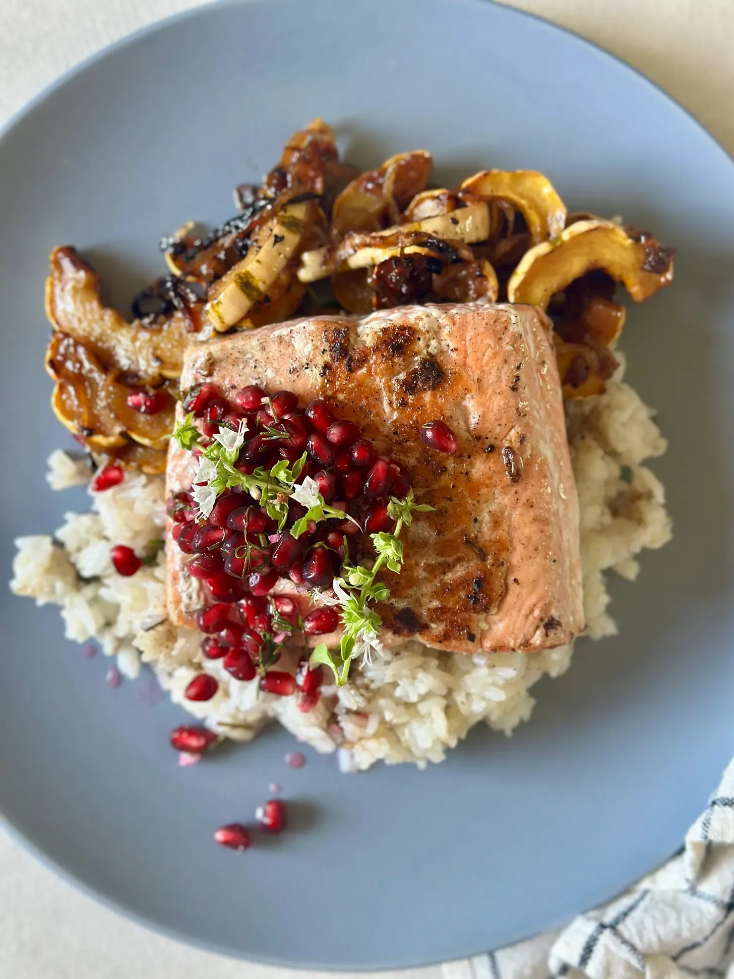 Seared Salmon with Pomegranate Salsa, Roasted Delicata Squash, and Caramelized Onions Over Basil-Lime Rice