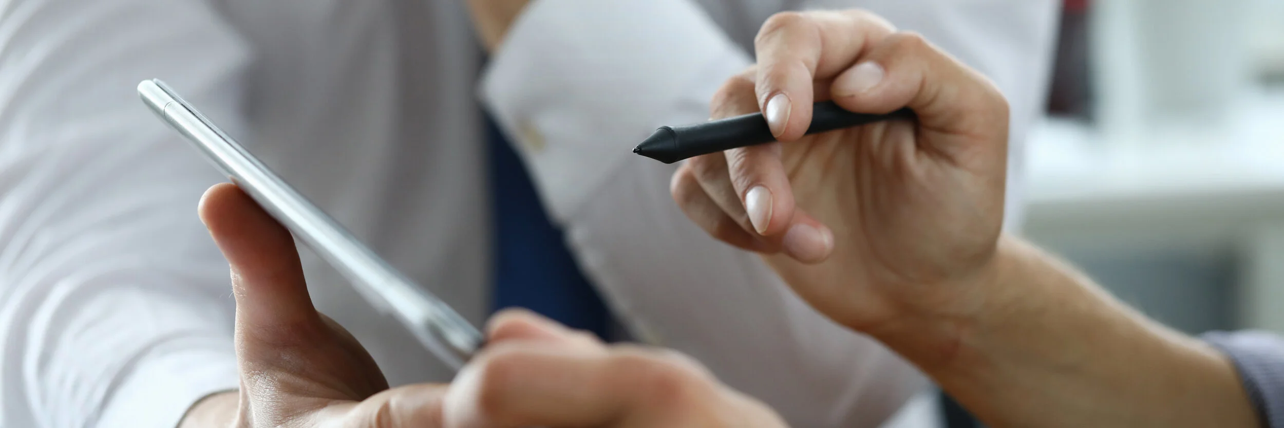 men-in-workplace-and-sign-an-electronic-document.jpg