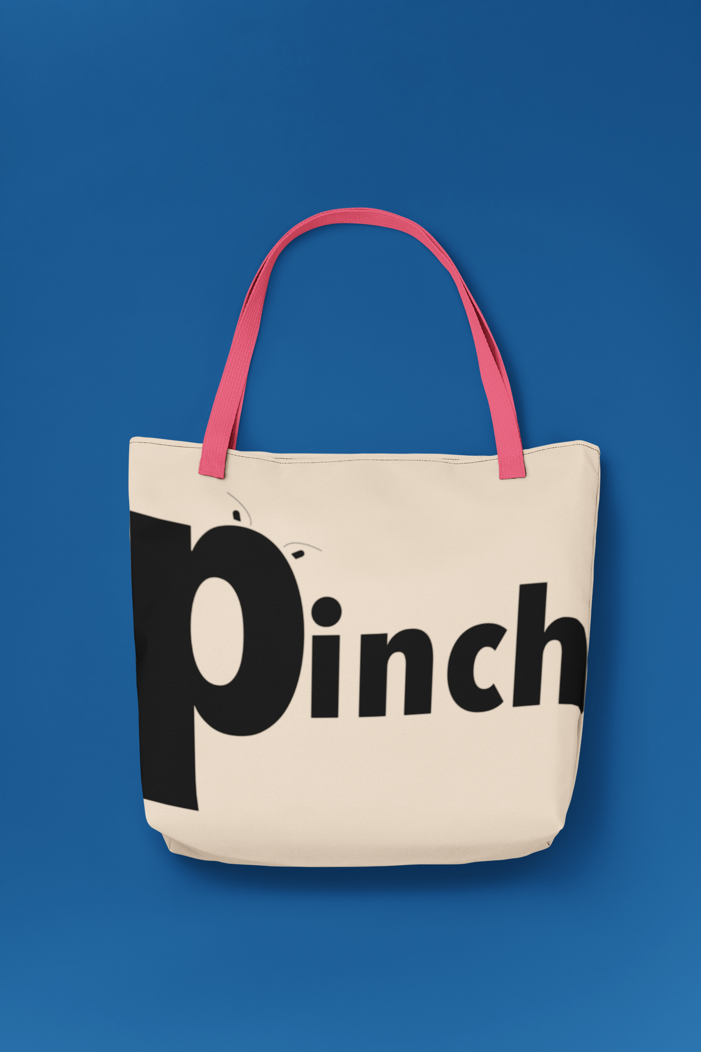 mockup-of-a-tote-bag-with-customizable-strap-placed-over-a-colored-surface-29606.png