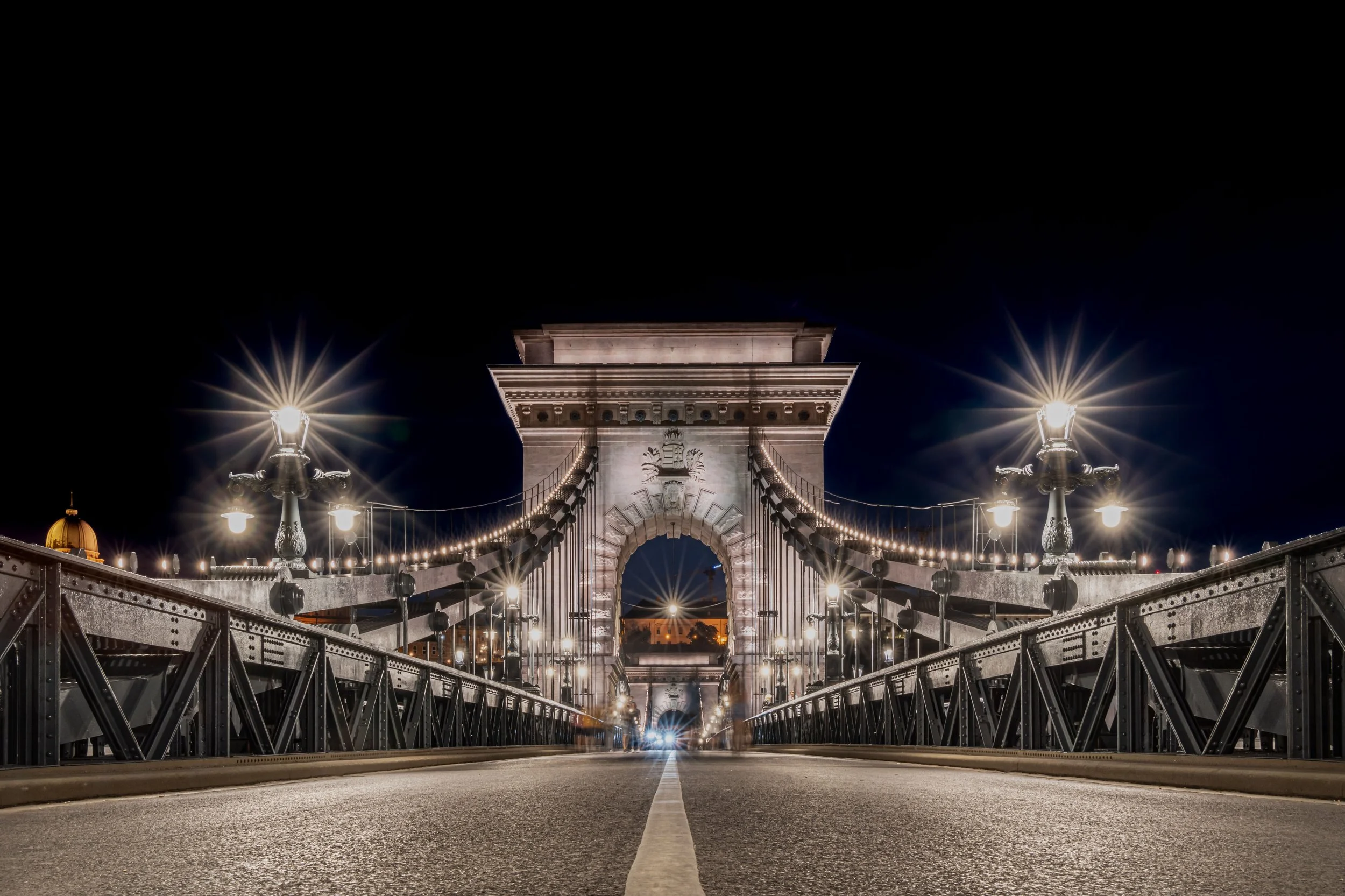 Budapest, Chain Bridge - Lions guard the gateway, where night lights transform steel and stone into timeless majesty.