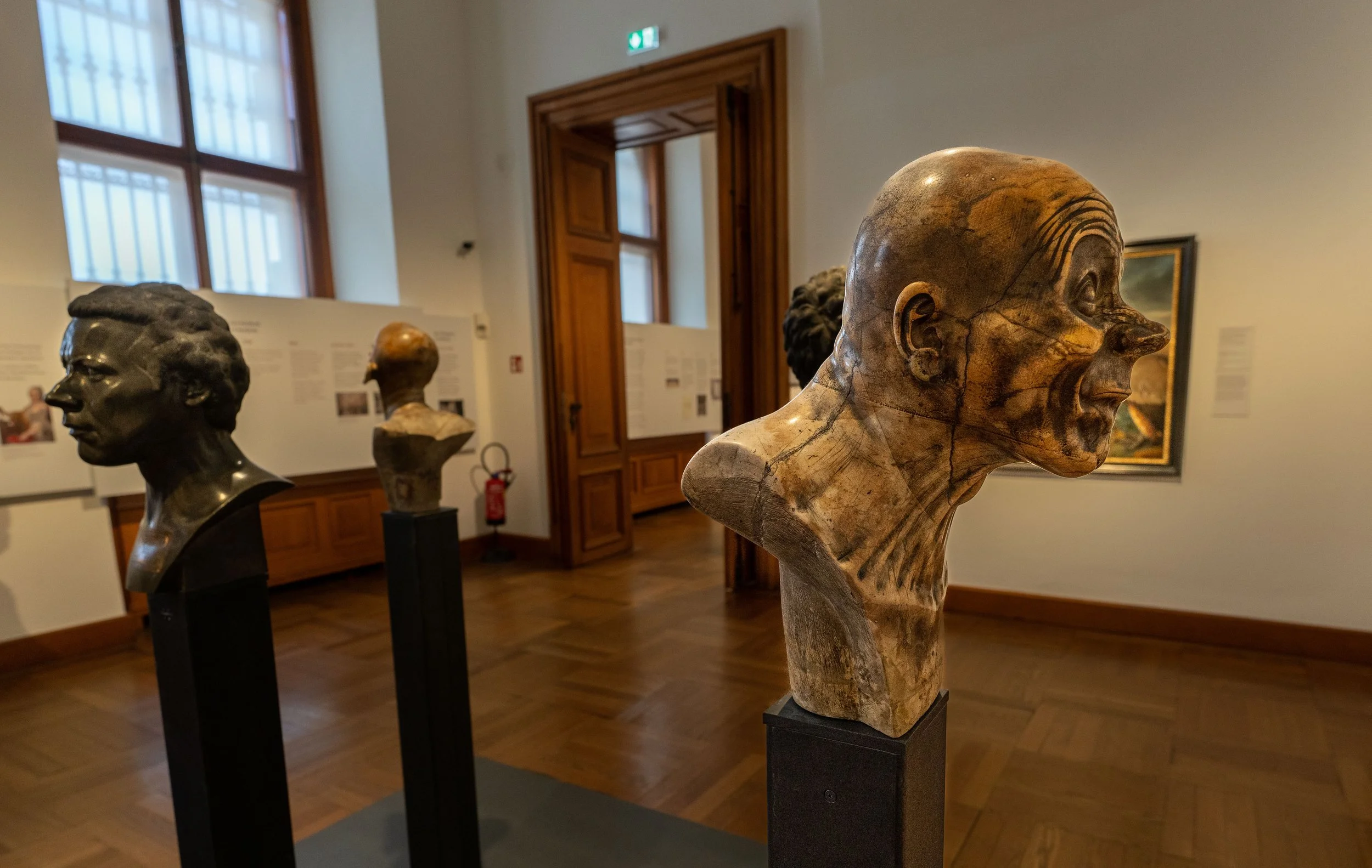Vienna, Leopold Museum - Expressionist faces frozen in sculpture, echoing Schiele’s Vienna, where art exposed society’s raw vulnerability.