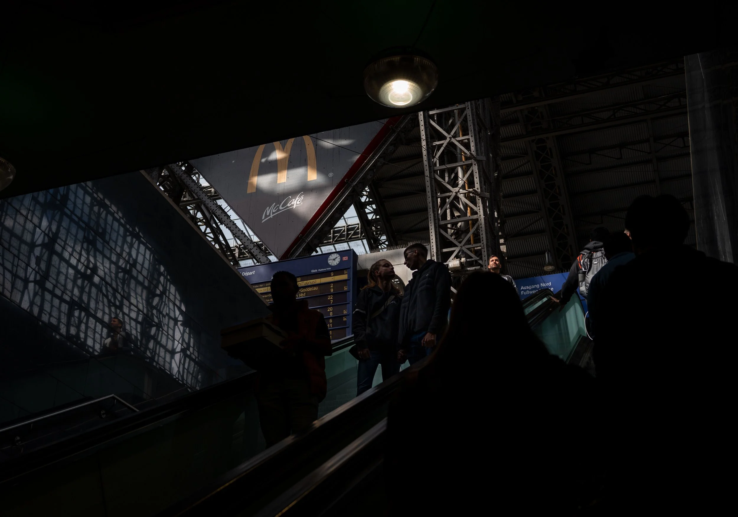 Frankfurt - Shadows conceal, light unveil - moments suspended between departure and return.