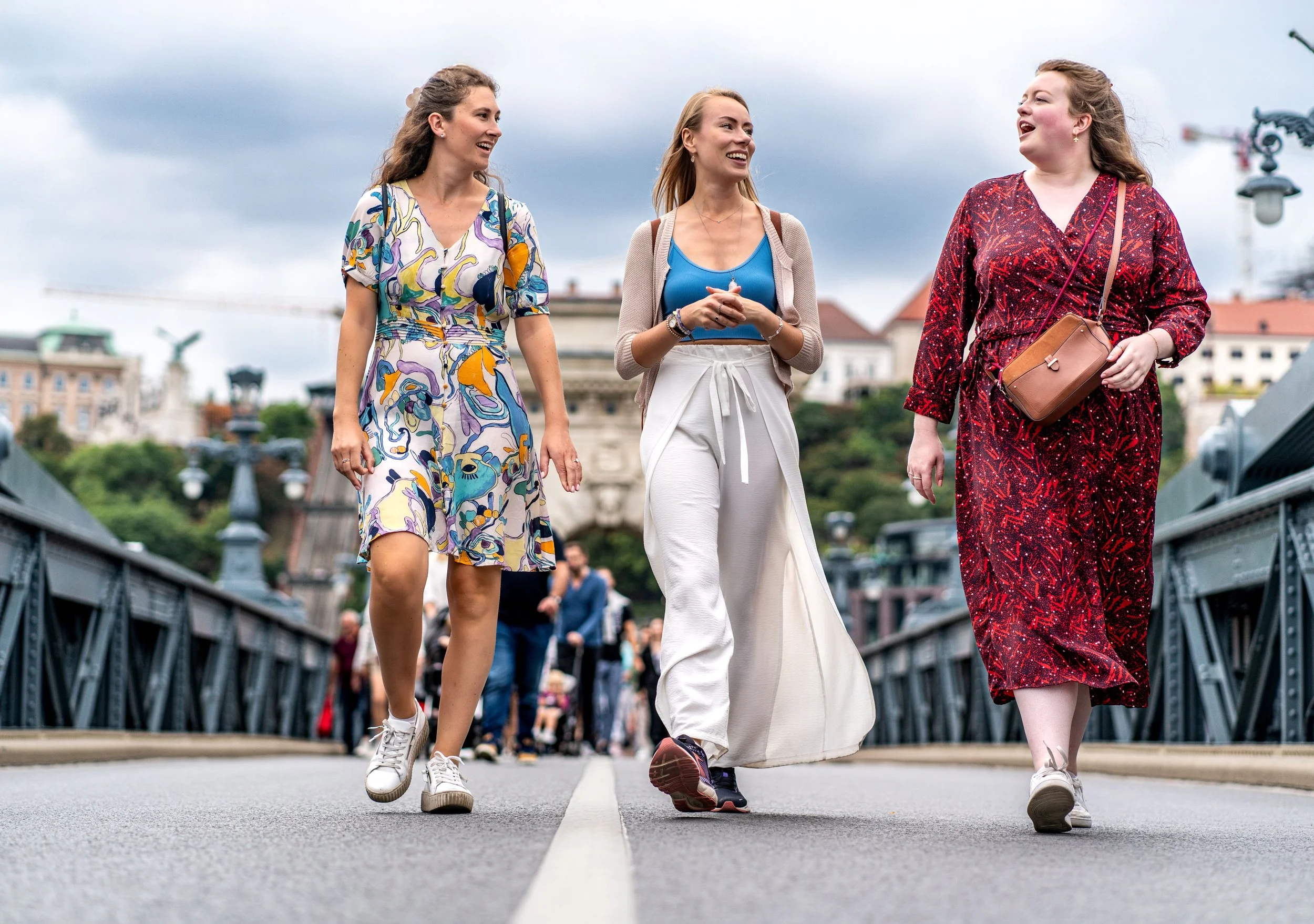 Steps in harmony, colors of life blending — Budapest becomes their stage, and the street their joy.