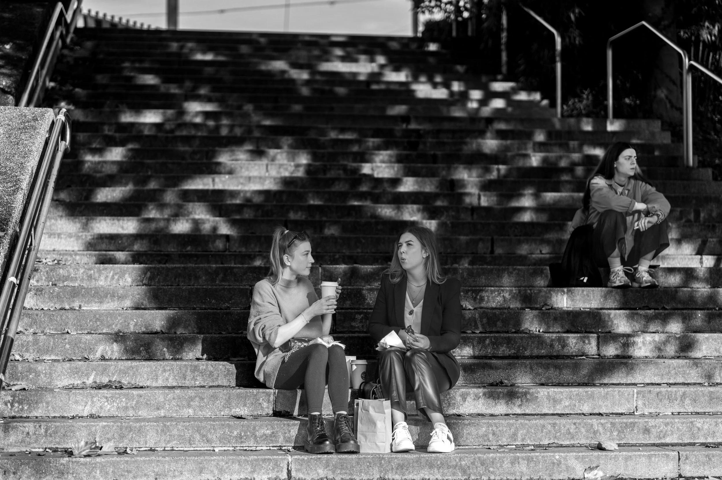 Vienna - Shadows fall like silent echoes, while voices linger on stone steps, weaving fleeting stories of connection.