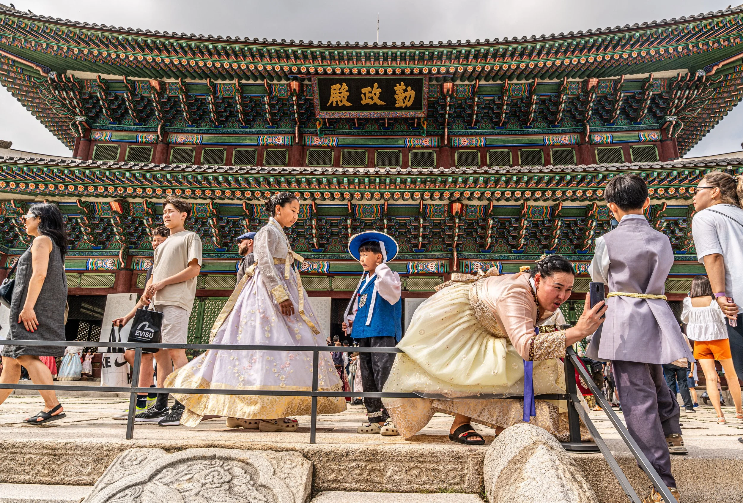 Seoul, Gyeongbokgung Palace - Hanbok-clad visitors animate royal halls, weaving Joseon legacy into today’s living tradition.