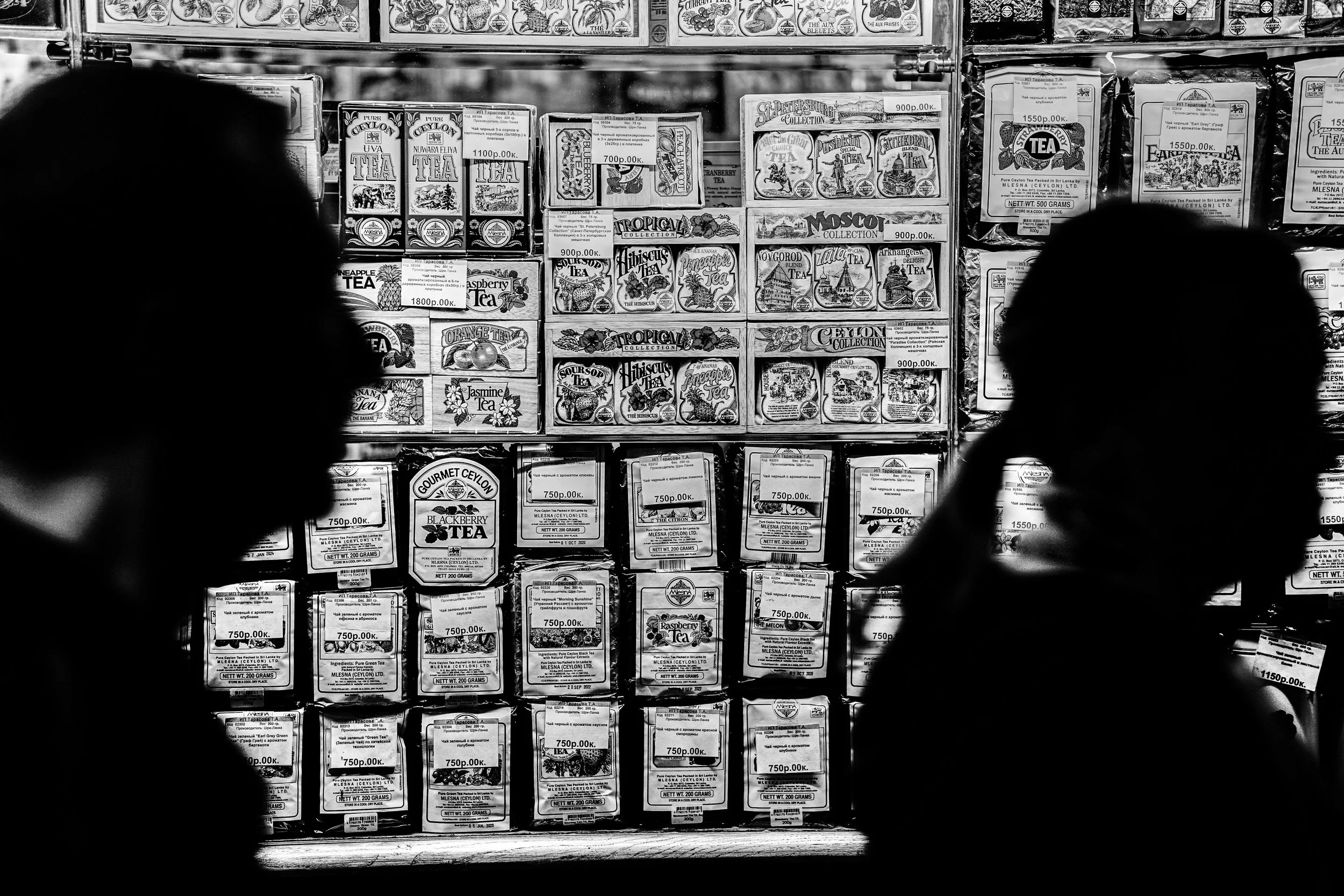 Moscow: Between rows of teas, passing shadows brew their own silent stories.