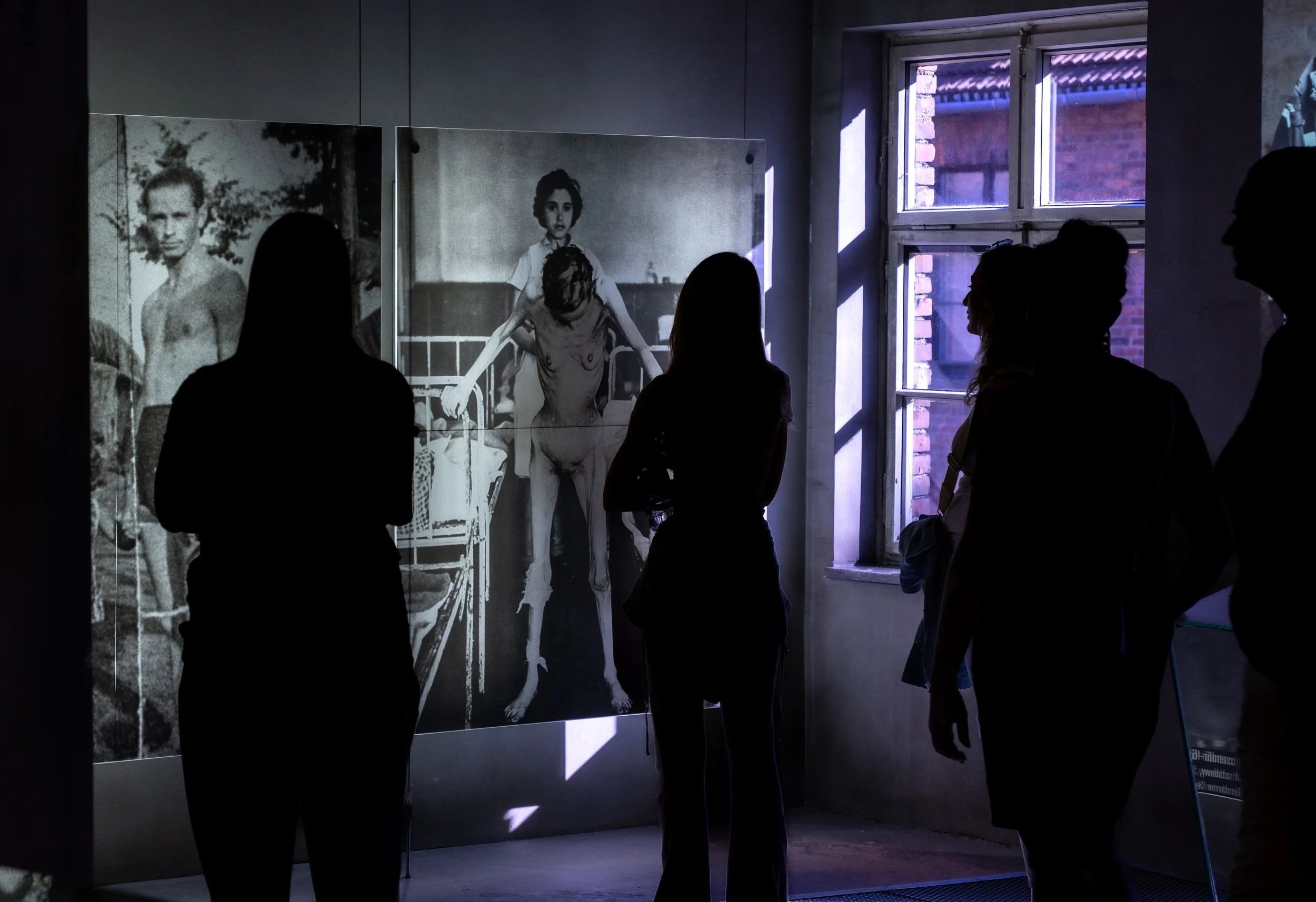 Faces and bodies of victims confront the silence of today’s visitors — a dialogue between memory and conscience.