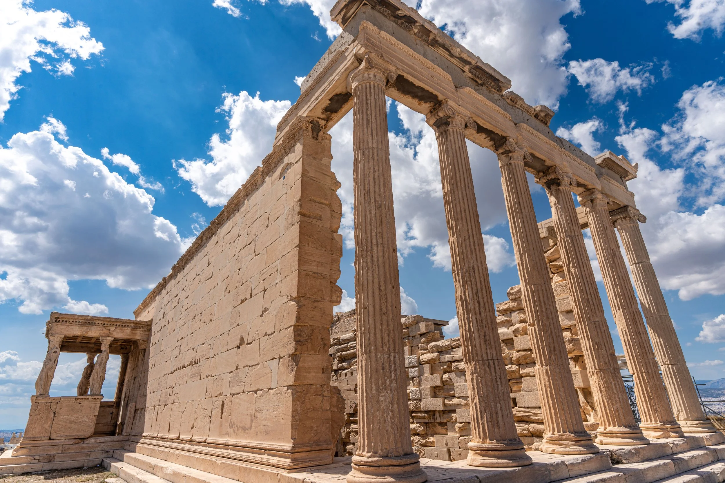 Athens, Acropolis — Erechtheion temple stands timeless, caryatids and columns weaving myth, devotion, and eternal stone memory.
