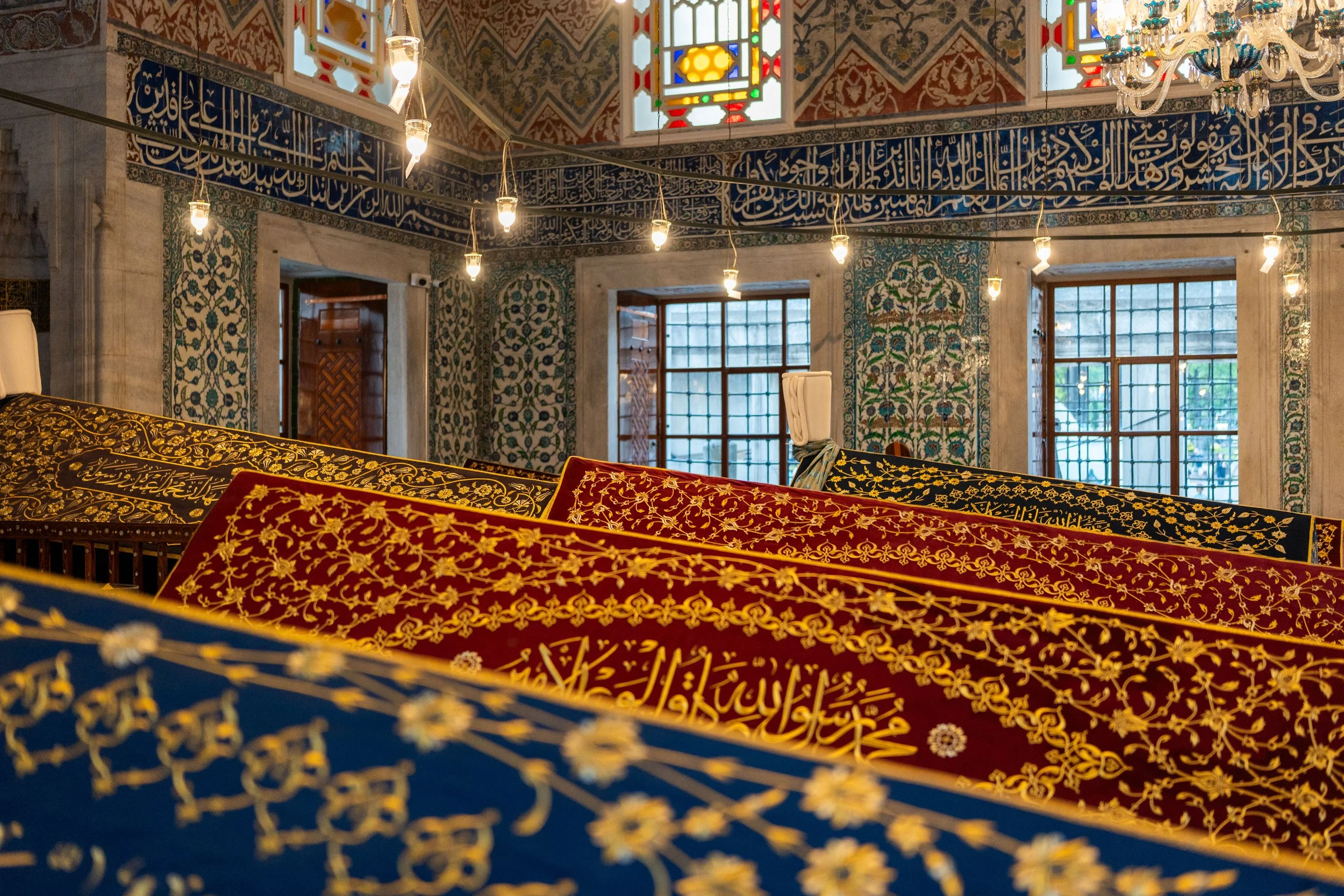 Istanbul, Sultan Tombs - Embroidered drapes and sacred calligraphy guard eternal rest of sultans within Ottoman grandeur.