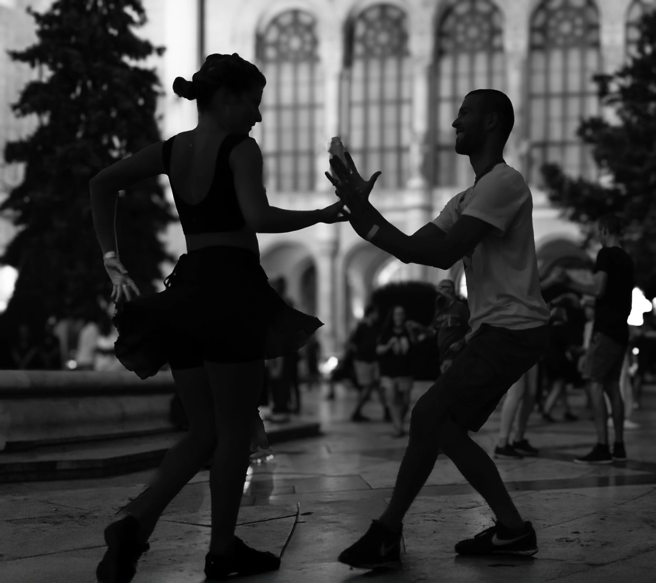 Budapest: In the city’s heart, two shadows meet in a fleeting choreography of light and laughter.