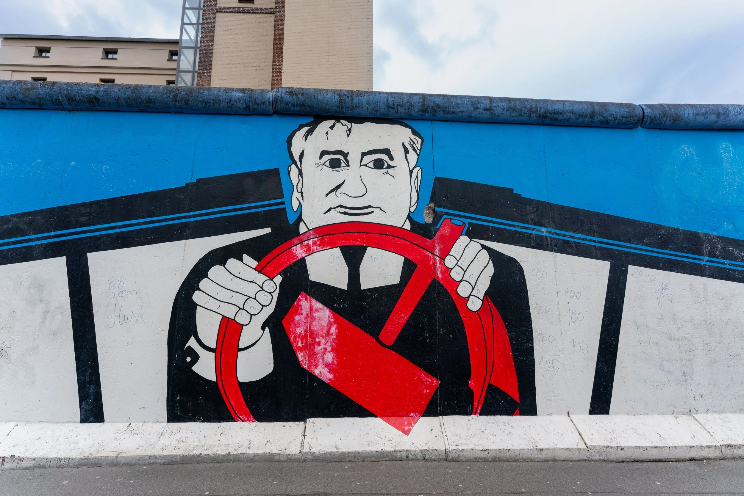 Berlin, East Side Gallery - Birgit Kinder’s Trabant crashes through the Wall, freedom breaking concrete, history transformed.