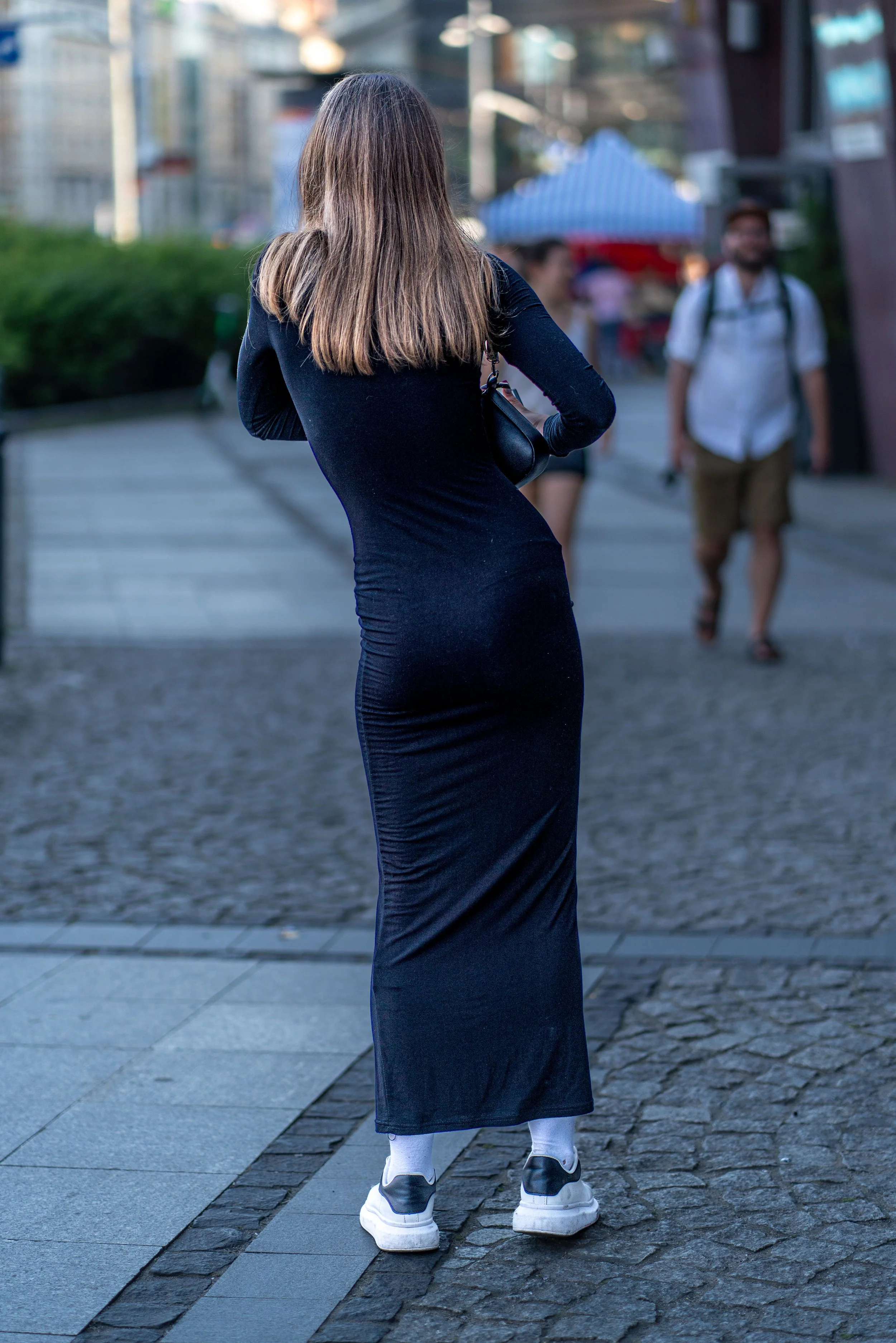 Wroclaw - A gesture captured in a suspended moment: energy and grace that transform the street into a stage.