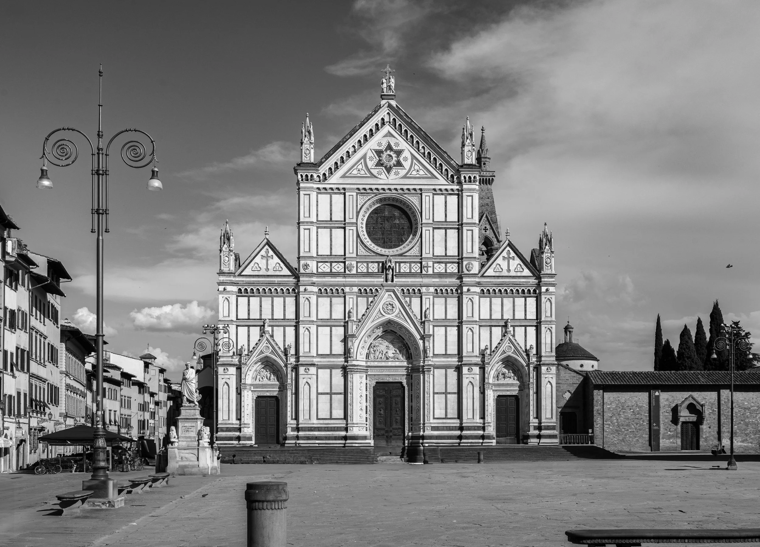 Firenze: The façade of Santa Croce gleams in silence, where centuries of faith stand against the sky.