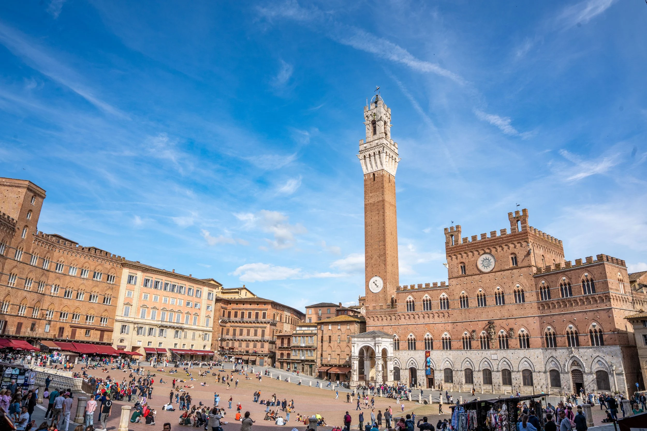 Siena, Piazza del Campo - Tower and Palazzo embrace the crowd, uniting past and present in Tuscany’s democratic square.