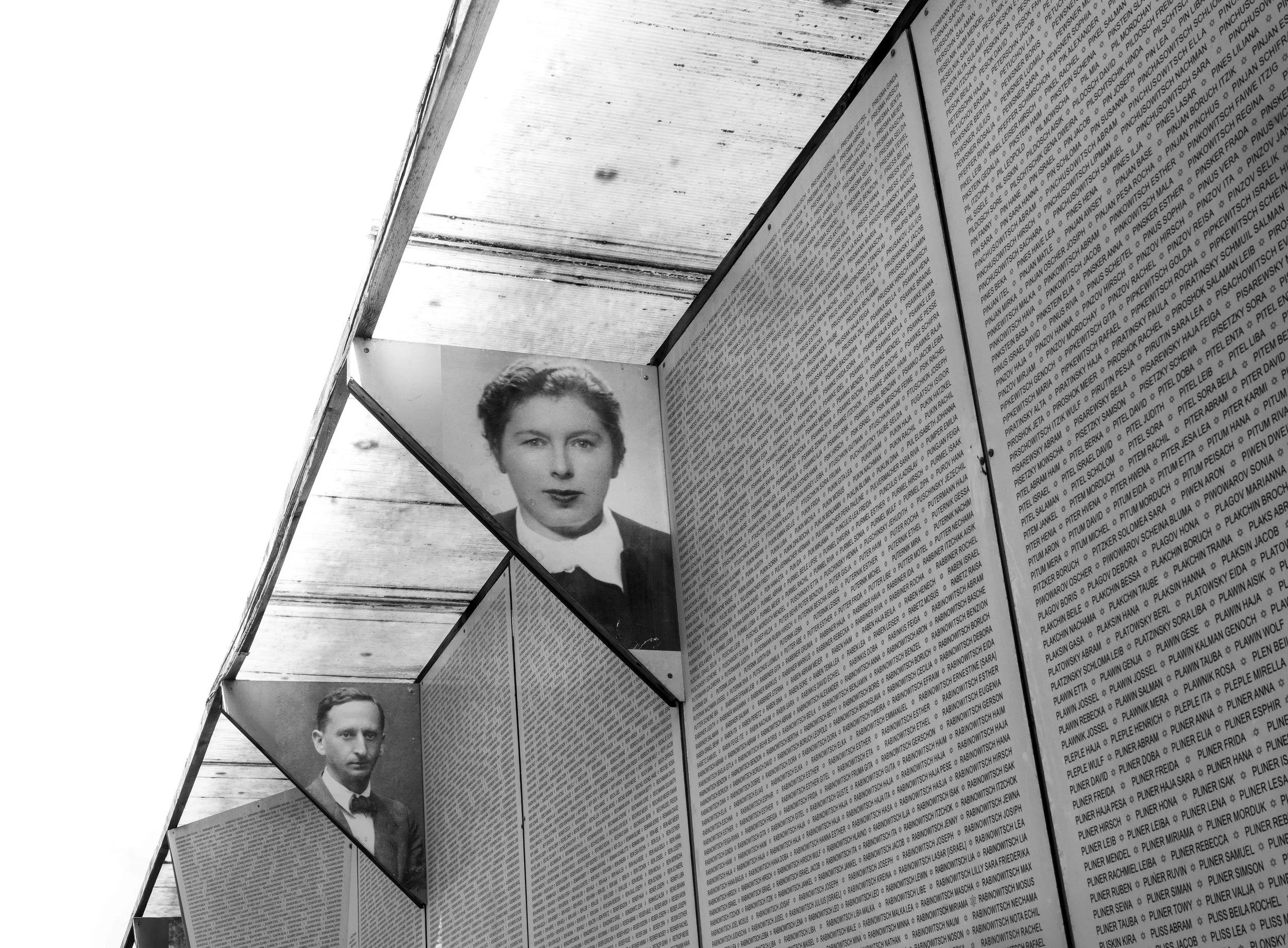 Faces of the Riga Ghetto, preserved against the endless list of names of the murdered.