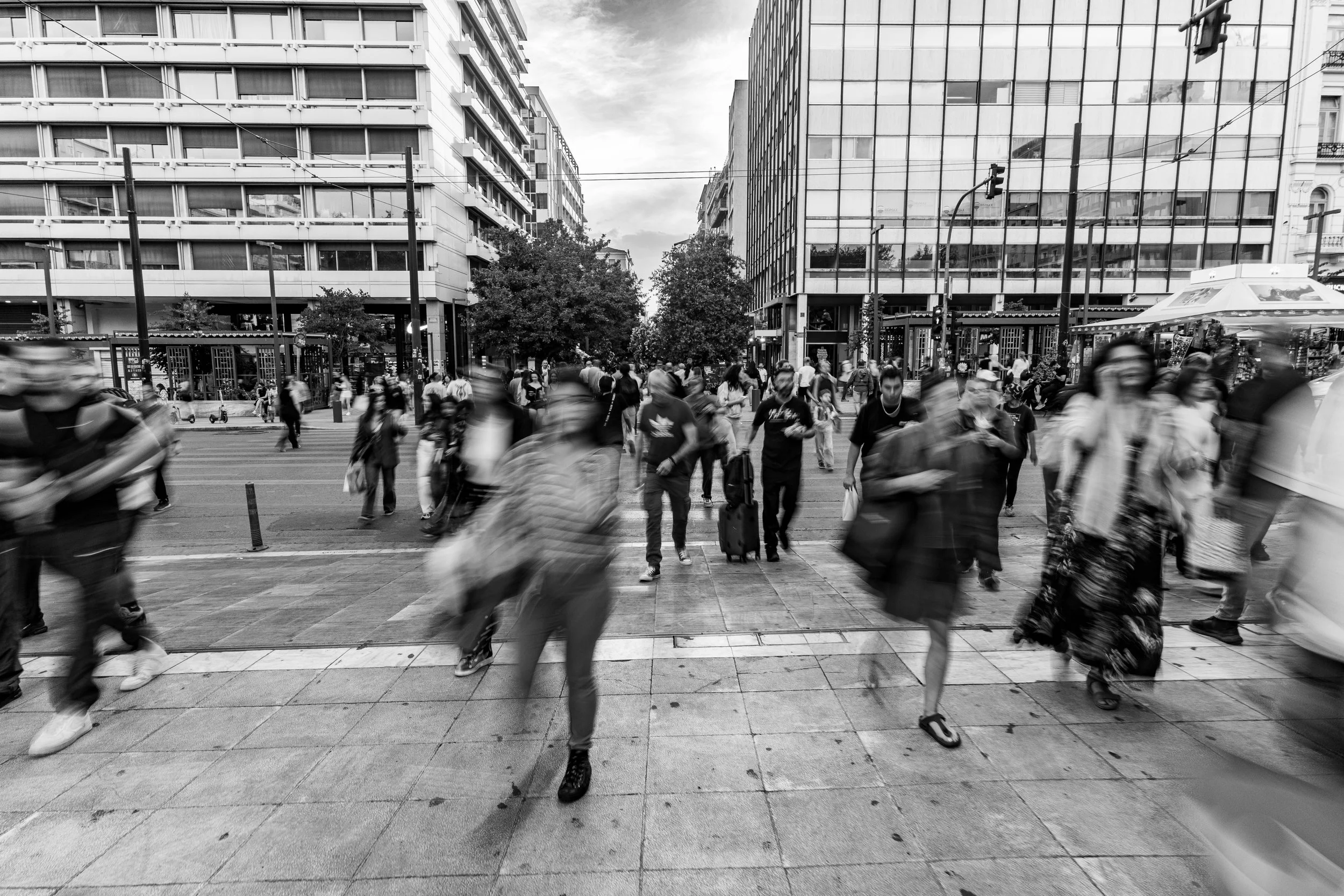 In rushing silhouettes, Athens reveals its heartbeat—faces fleeting, yet the city’s spirit lingers eternal.
