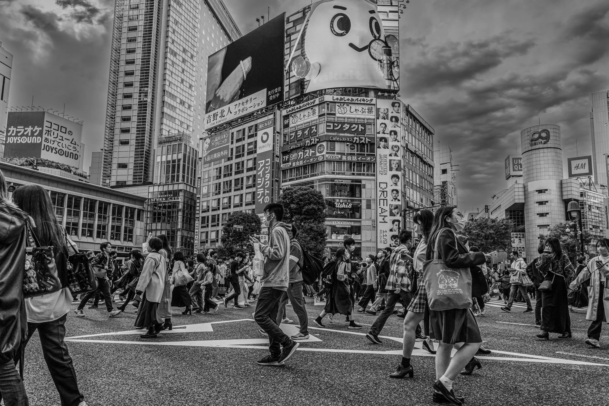 Tokyo - Shibuya Crossing tides of neon nights, each step carries the heartbeat of a restless city.