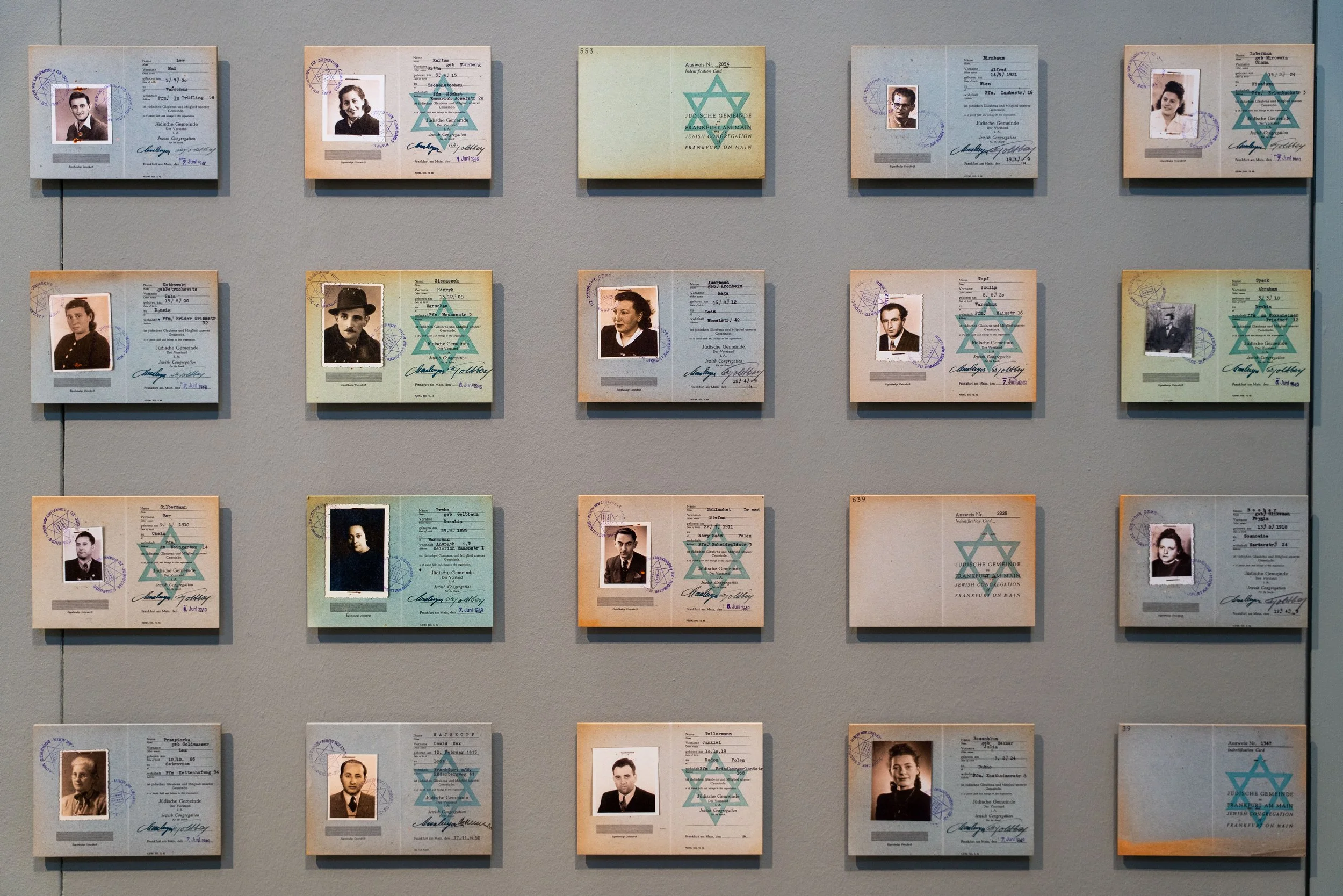 Berlin. Identity cards marked with the Star of David — names and faces stripped of dignity, yet preserved in memory.