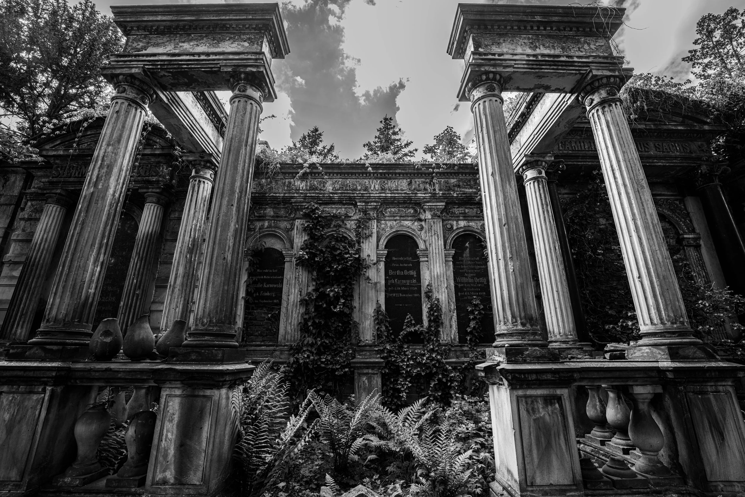 Wrocław, Old Jewish Cemetery - Broken pillars rise among graves, a timeless testimony of absence, resilience, and sacred remembrance.