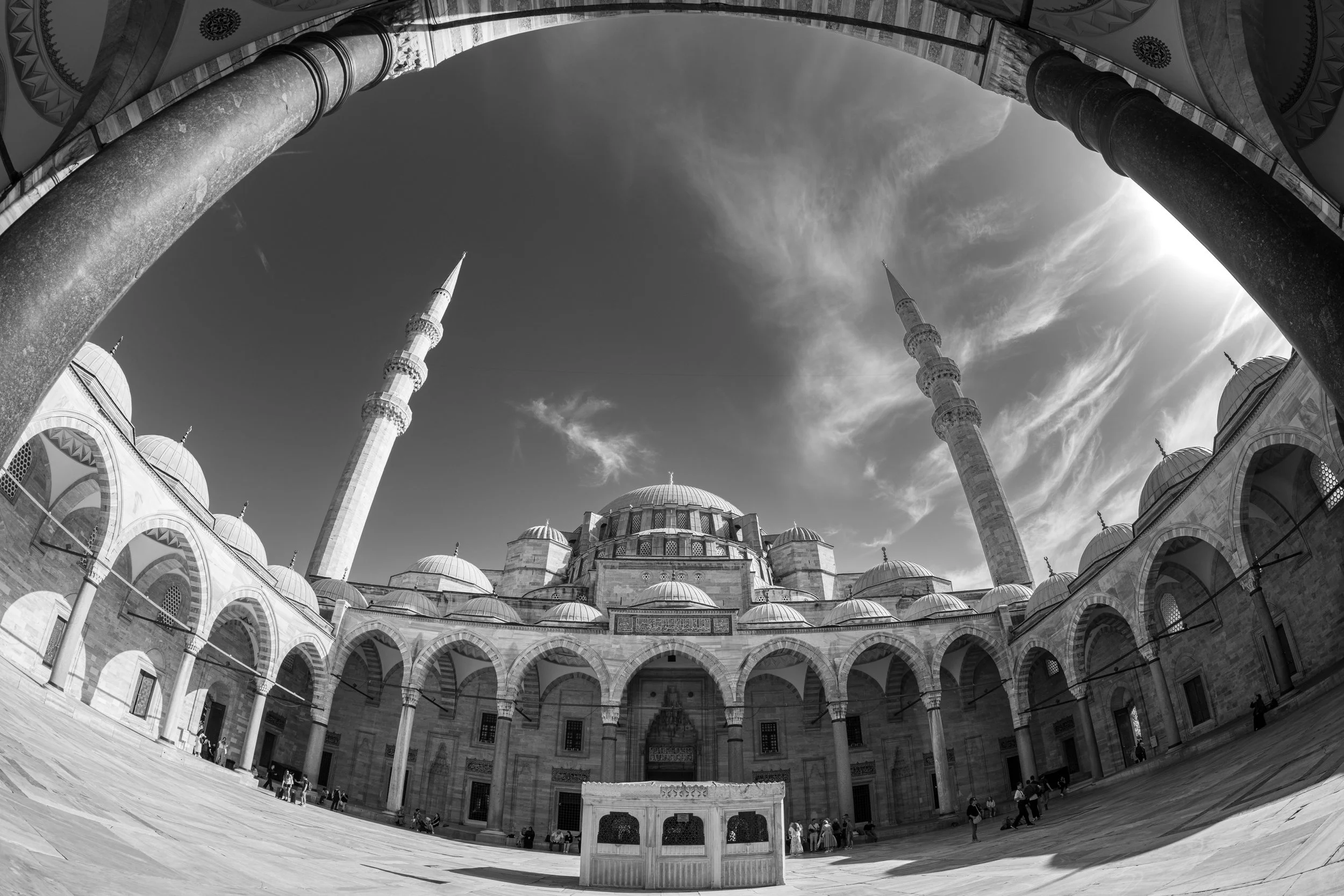 Istanbul, Süleymaniye Mosque - Arches frame the sky, minarets echo prayers, history rises in harmonious Ottoman majesty.