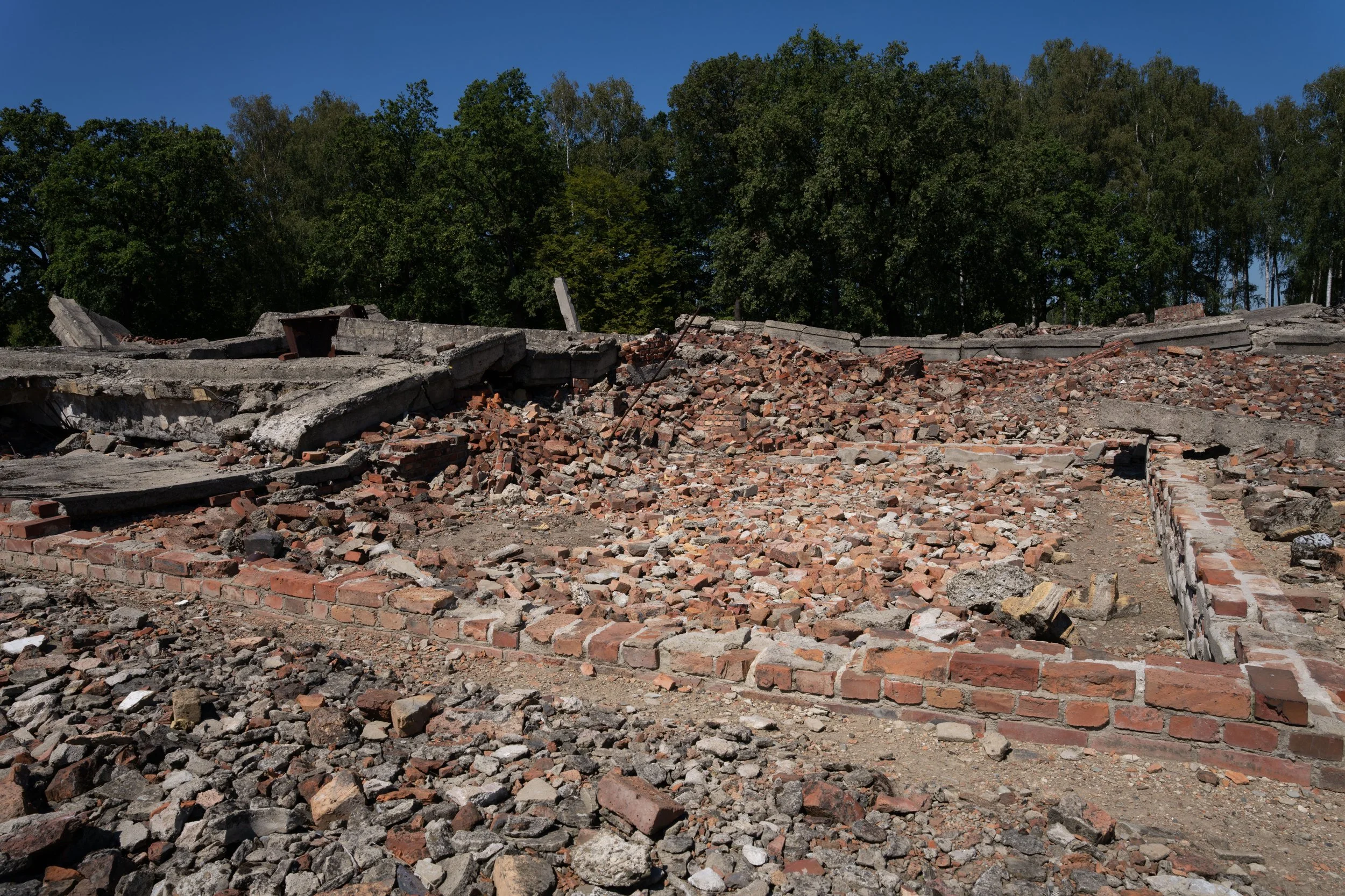 Auschwitz-Birkenau gas chambers: where humanity fell into darkness. May remembrance keep the light alive.
