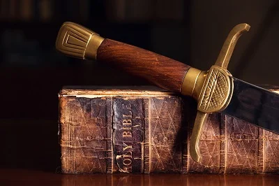 bigstock-old-bible-with-sword-66114910-2.jpg