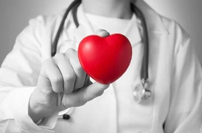 bigstock-doctor-holding-a-red-heart-49195958.jpg